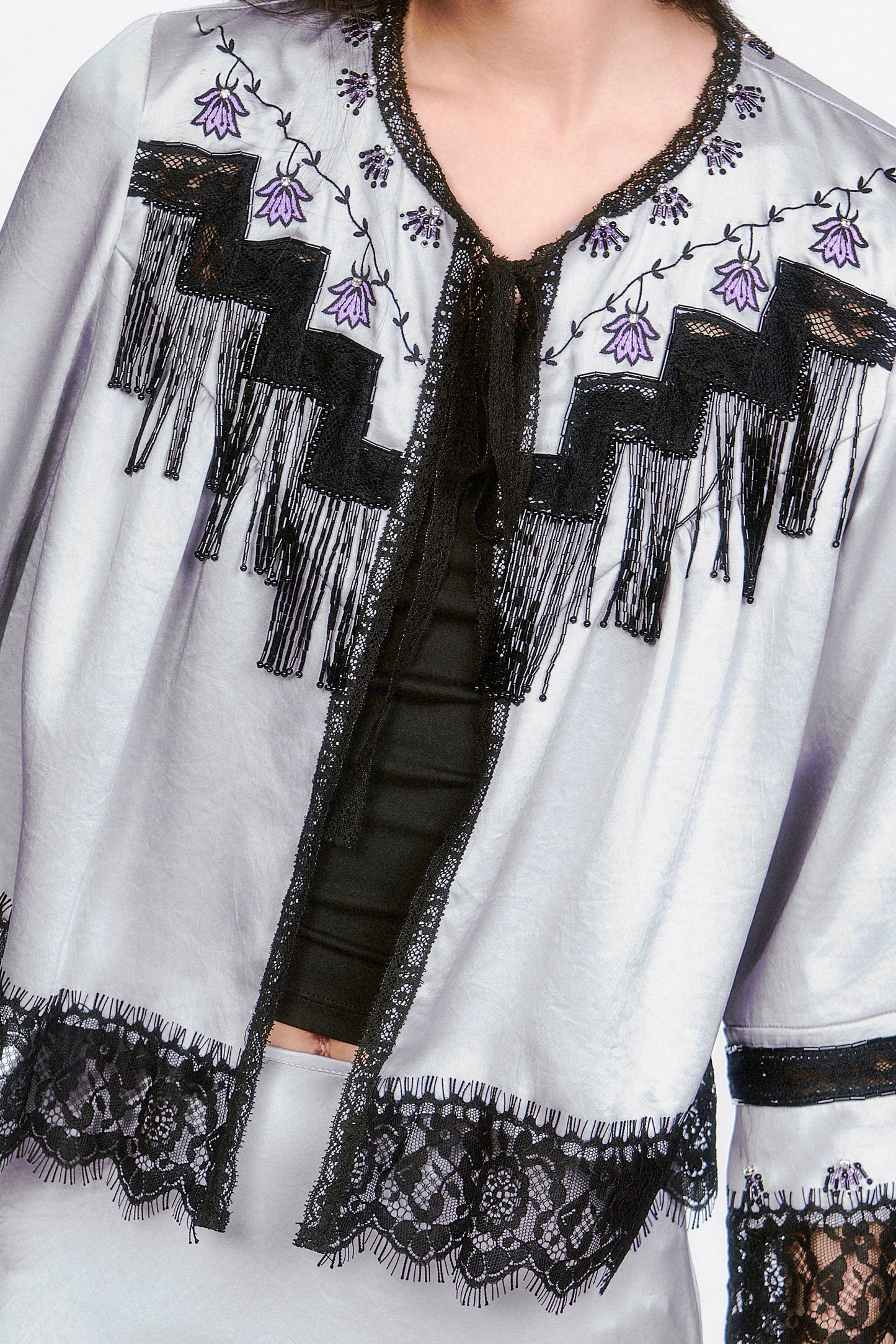 Detail of Boudoir Satin Beaded Fringe Bed Silver jacket elevates both stylish and classy looks.