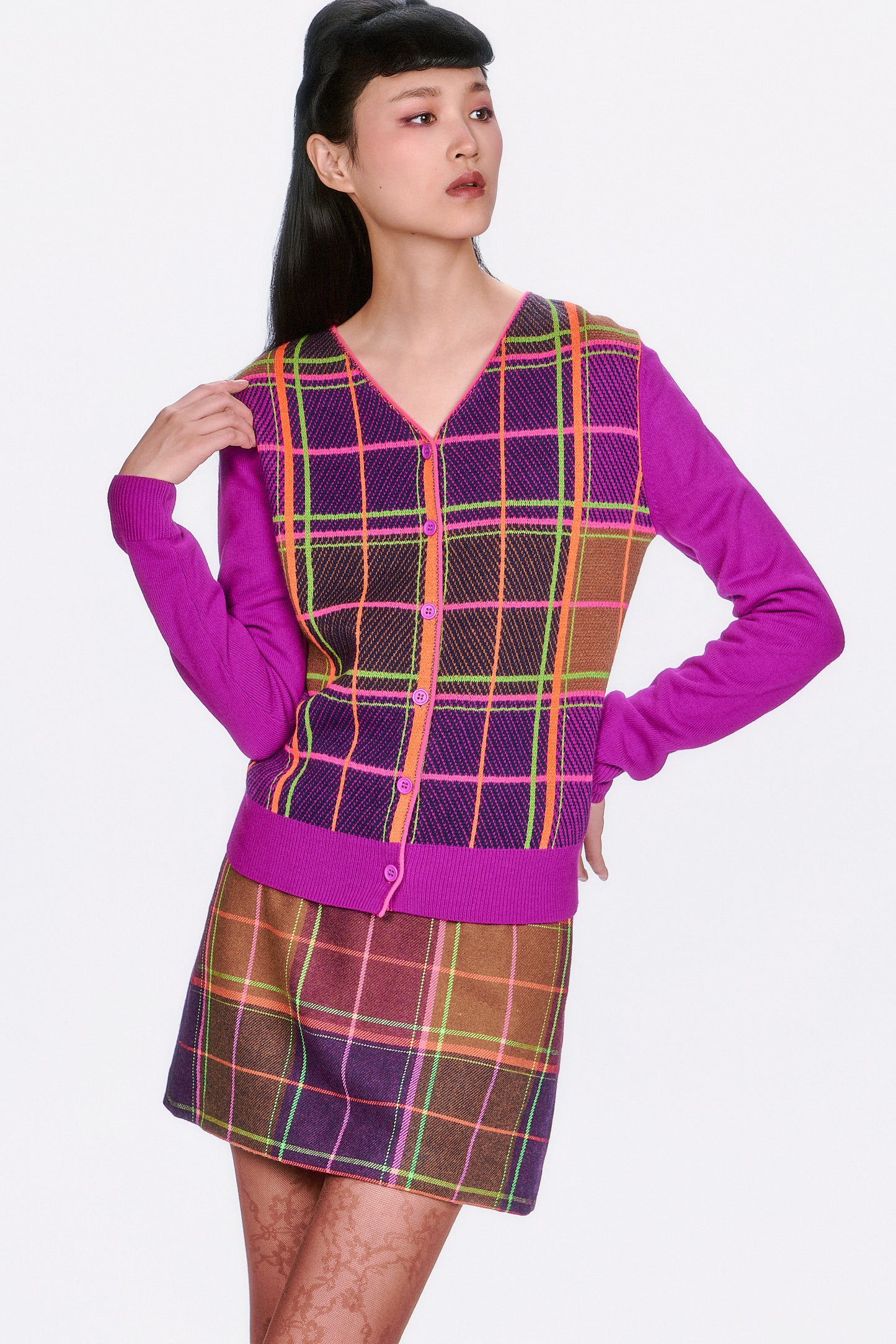 Person wearing Long Sleeves Plaid Cardigan – Magenta intersecting lines in green, pink and orange.
