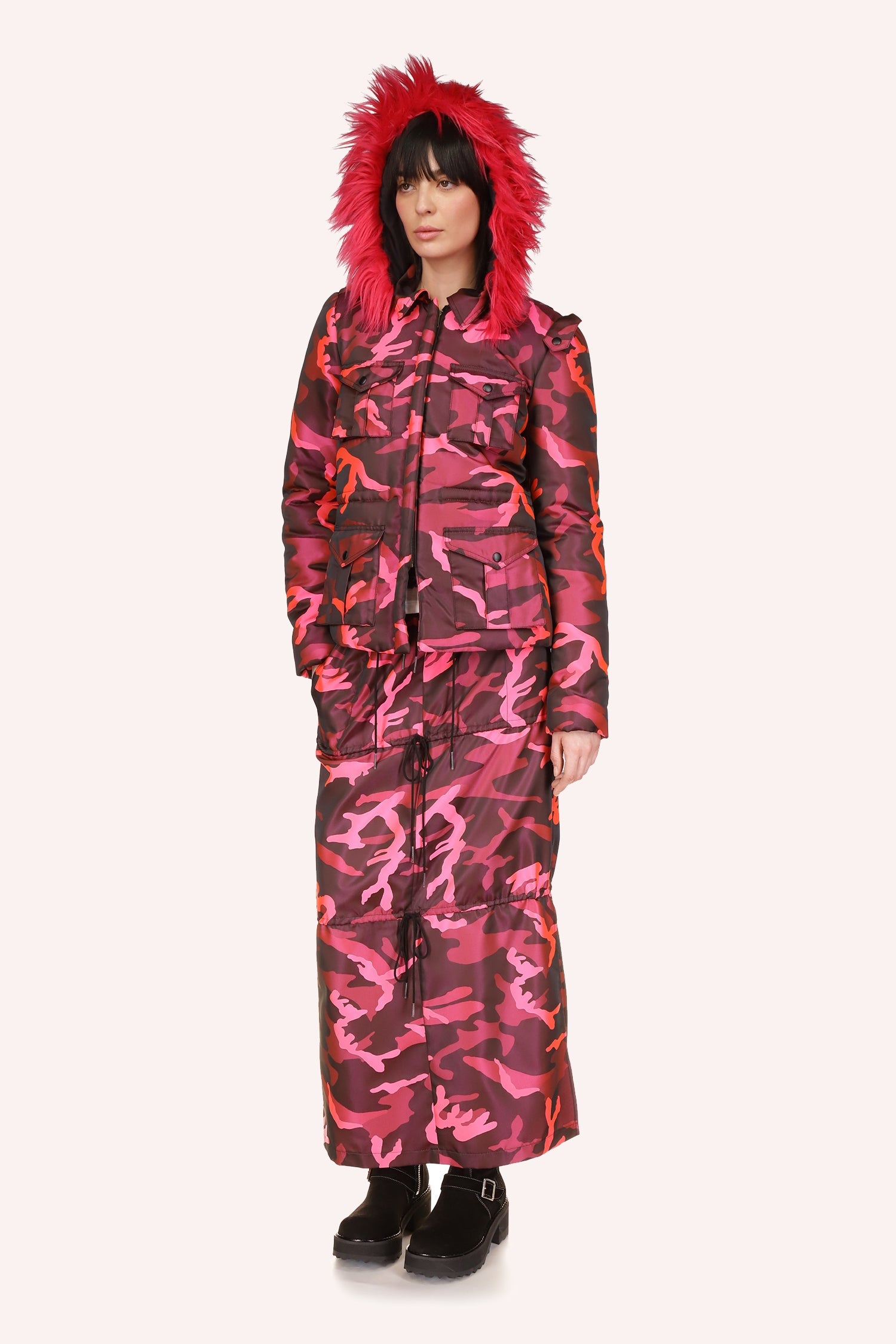 Jacket hip-length with fluffy fur hood, four pockets 2 on chest and 2 at the bottom, and a waist belt