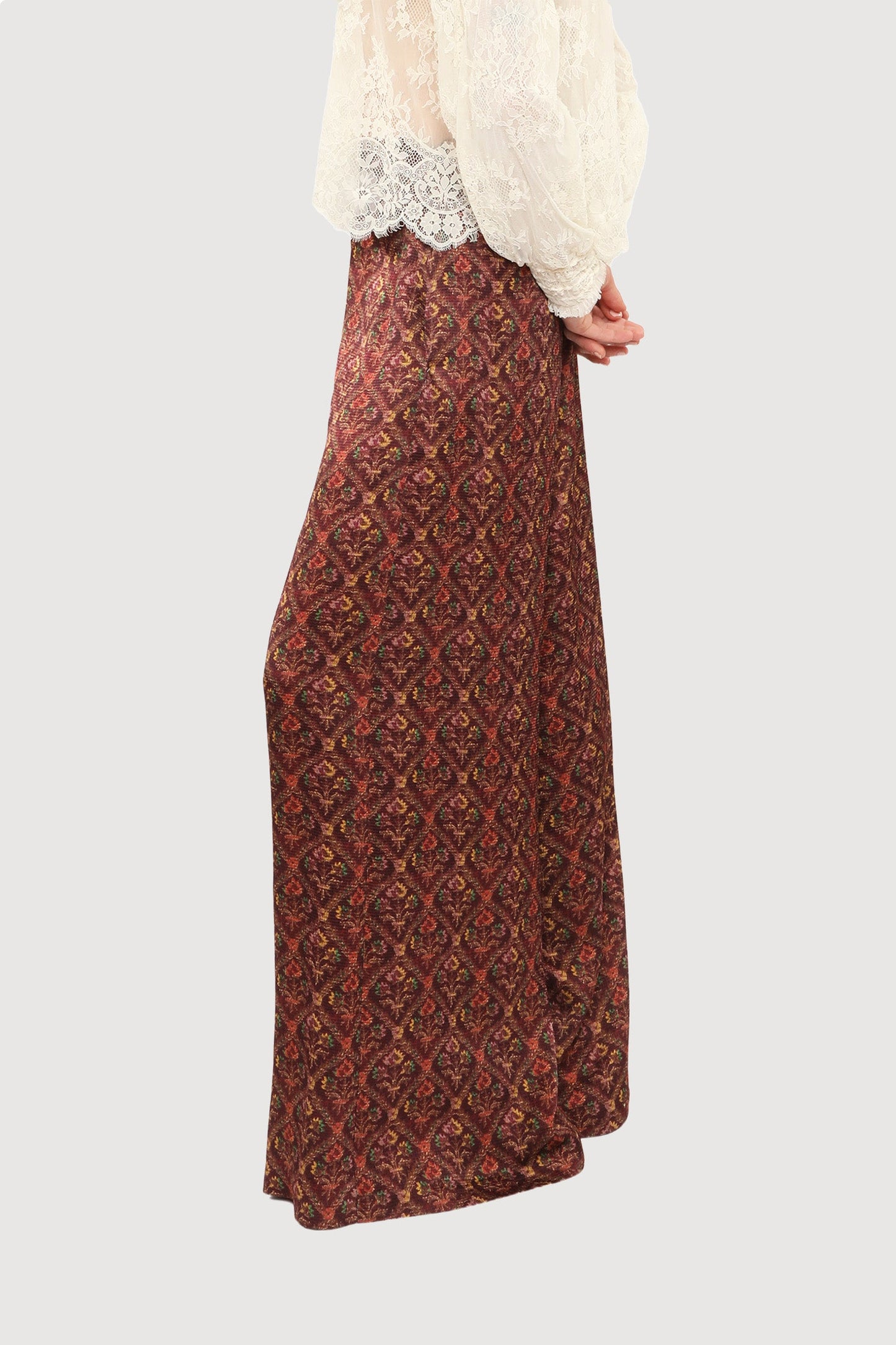 Woman wearing Victorian Lace Blouse and large Garnet Wallpaper Medley baggy/loose Pants.