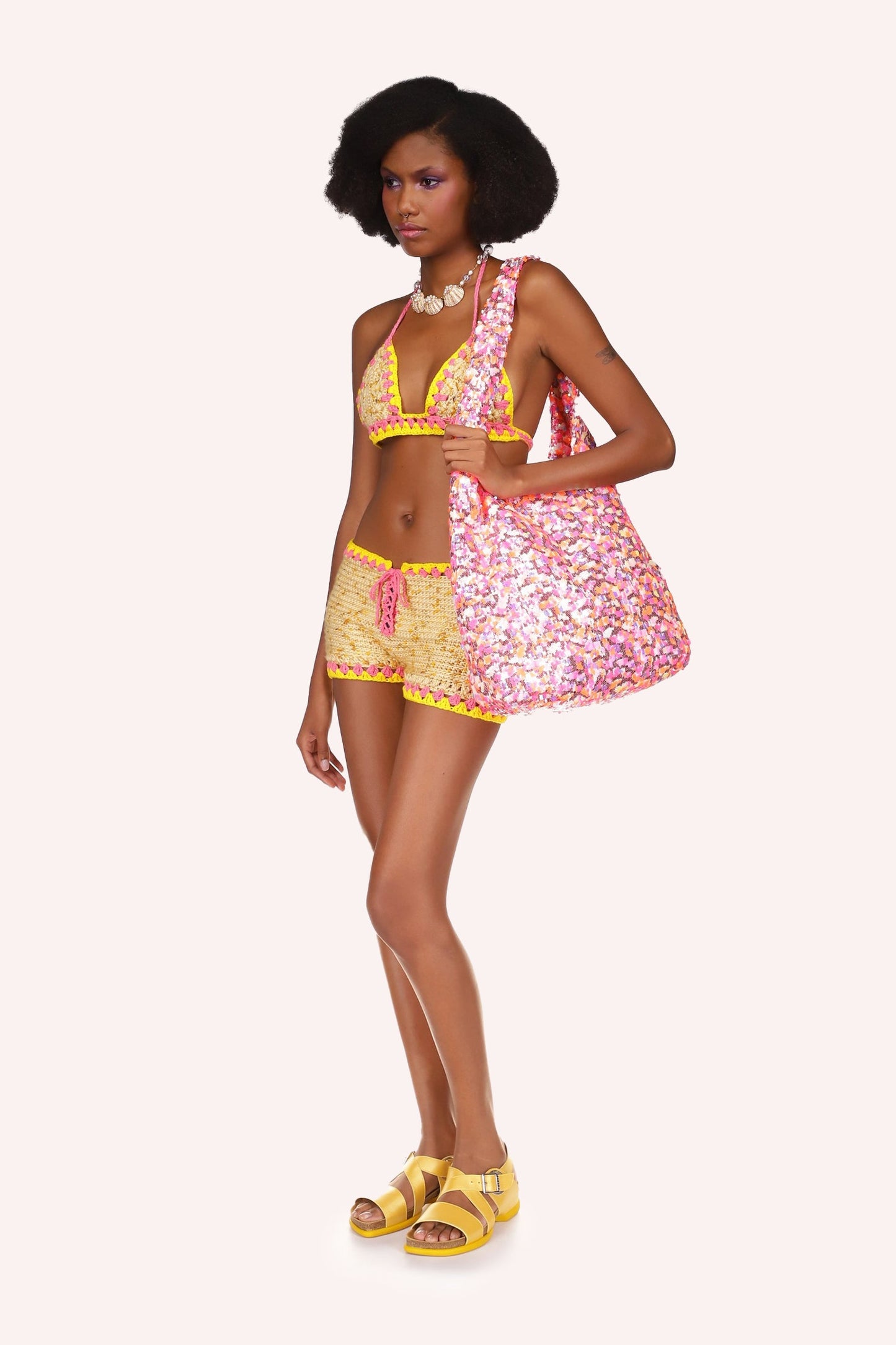 Rivera Crochet Set Marigold, top is tied with a pink ribbon, 2-straps goes over the shoulders.