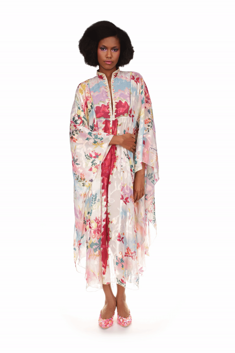 Kaftan, long flowing garment in see-thru fabric, long sleeves, open in front with large red hems