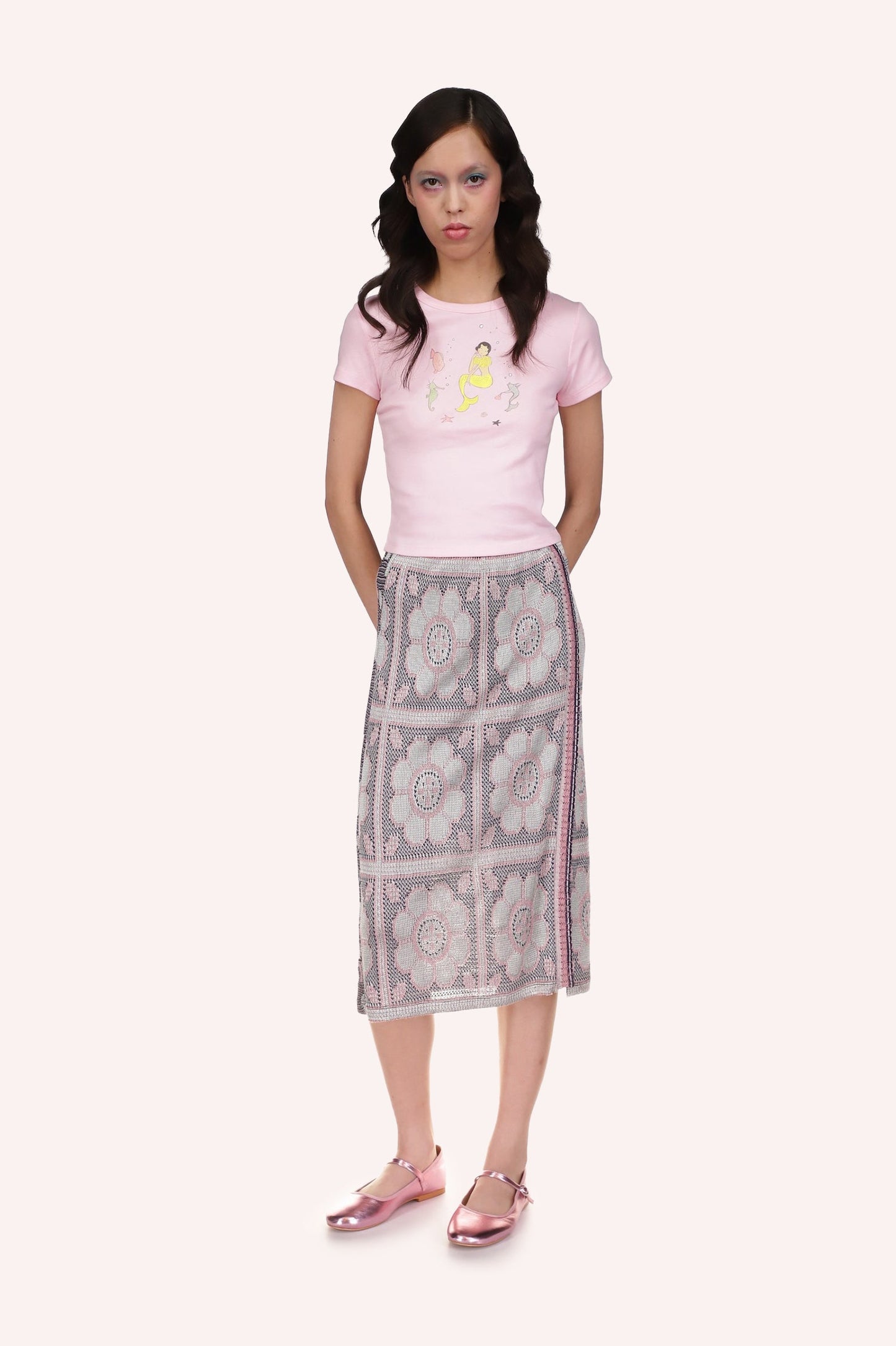 Opalescent Knit Skirt is in grayish color with large squares with circle inside pattern