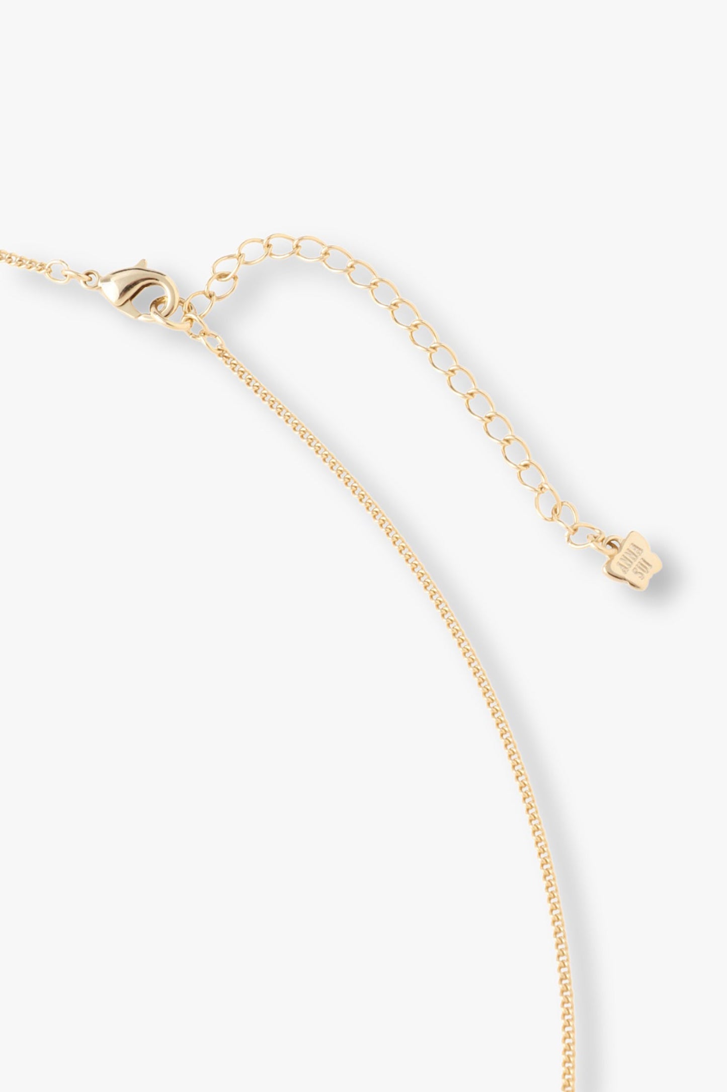 Yellow gold lobster claw clasp with large links for adjustability, Anna Sui imprint on a tag