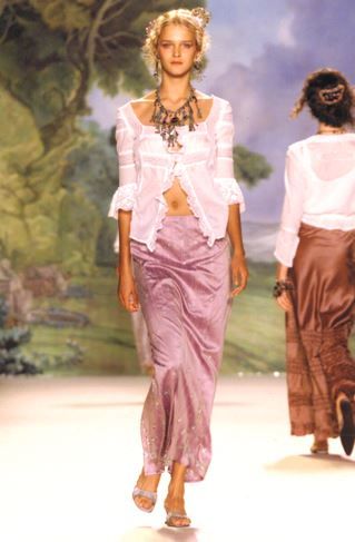 On runway, Cluny Lace Trimmed Floral Swiss Dot Blouse, with a purple skirt, and large neckless