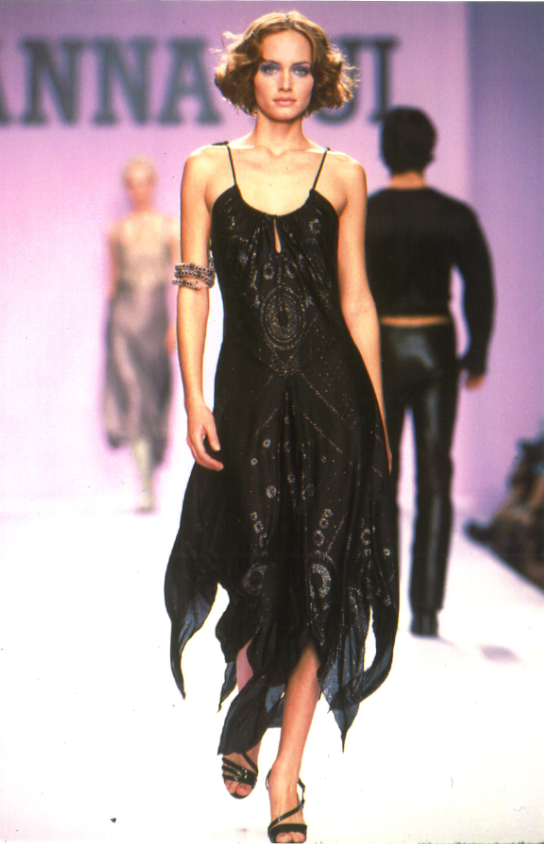 In a runway setting, Sleeveless Jubilee Black Velvet Godet Dress, Step into timeless elegance