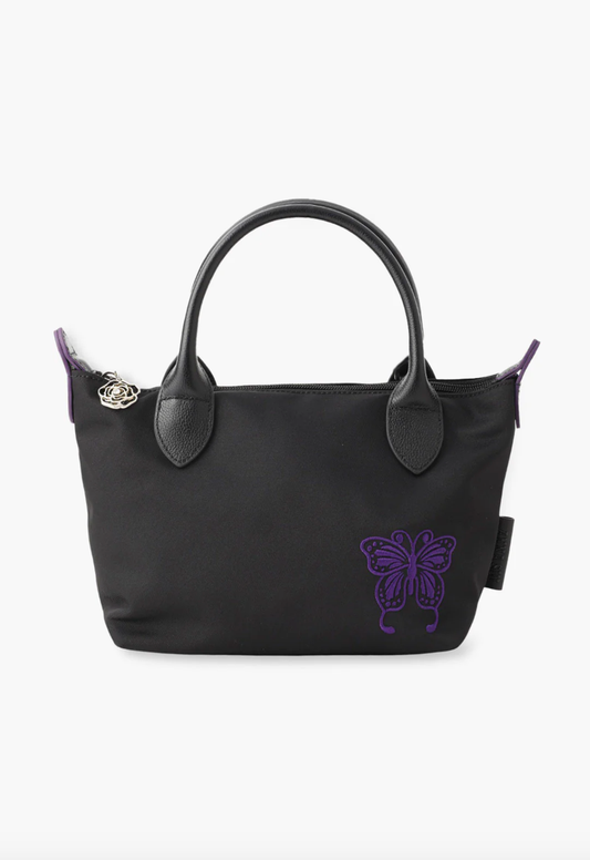 Tote in black, 2-handled, Anna Sui purple embroidered Butterfly signature bottom right of the bag