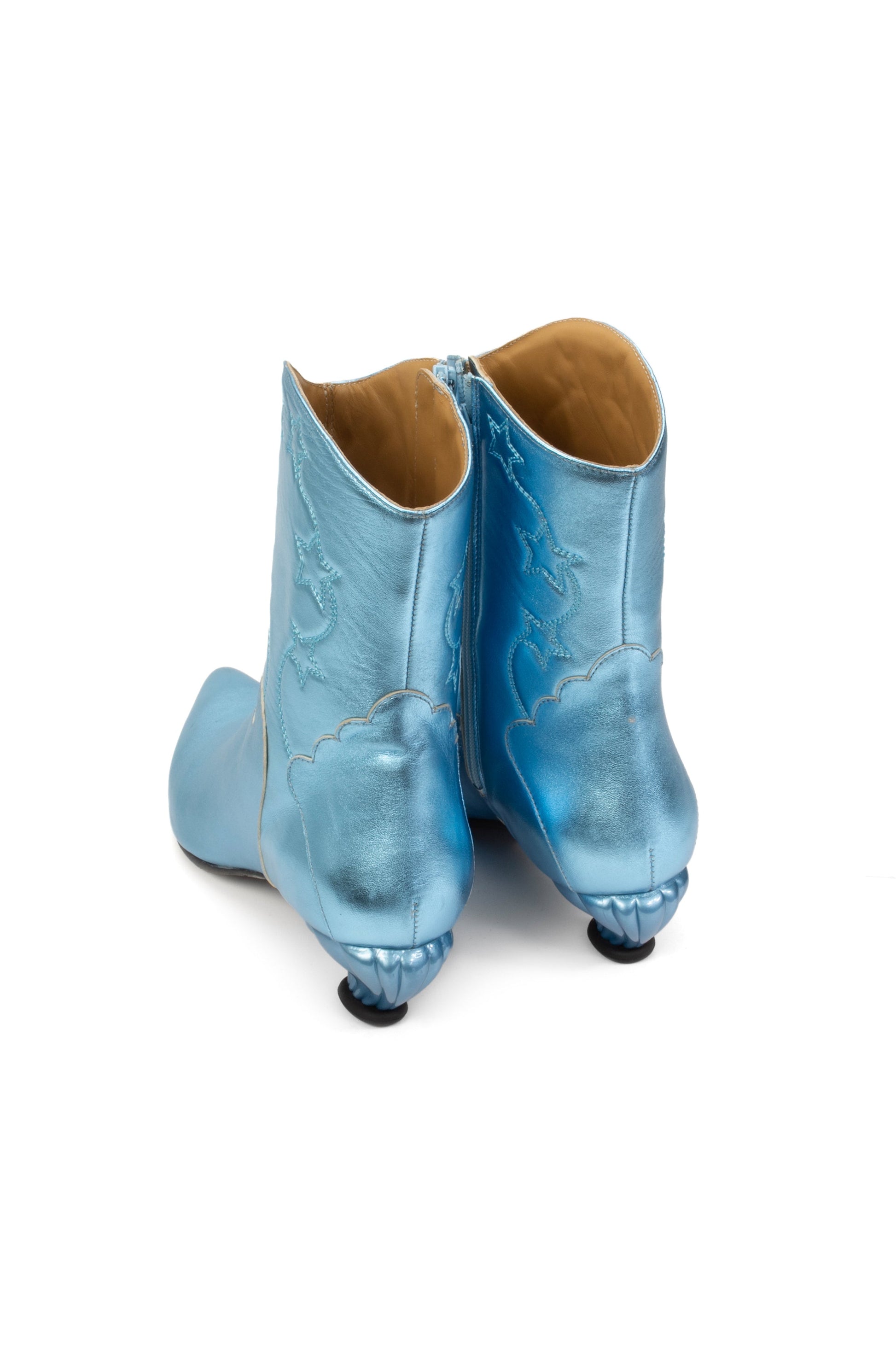Carefully stitched and crafted boots with the same pattern on the ankles and front part