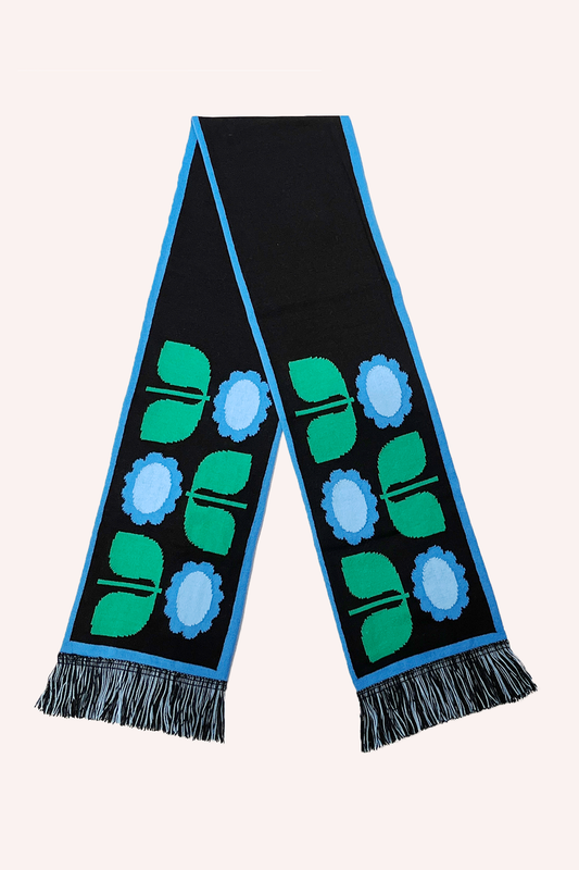 Black Scarf, light blue hem, 3 stylized daisies alternating on each end, 2 shades of blue, green stem