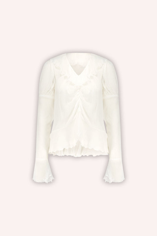 White crinkled chiffon blouse, long sleeves, flowing style with ruffles on the shoulders and cuffs