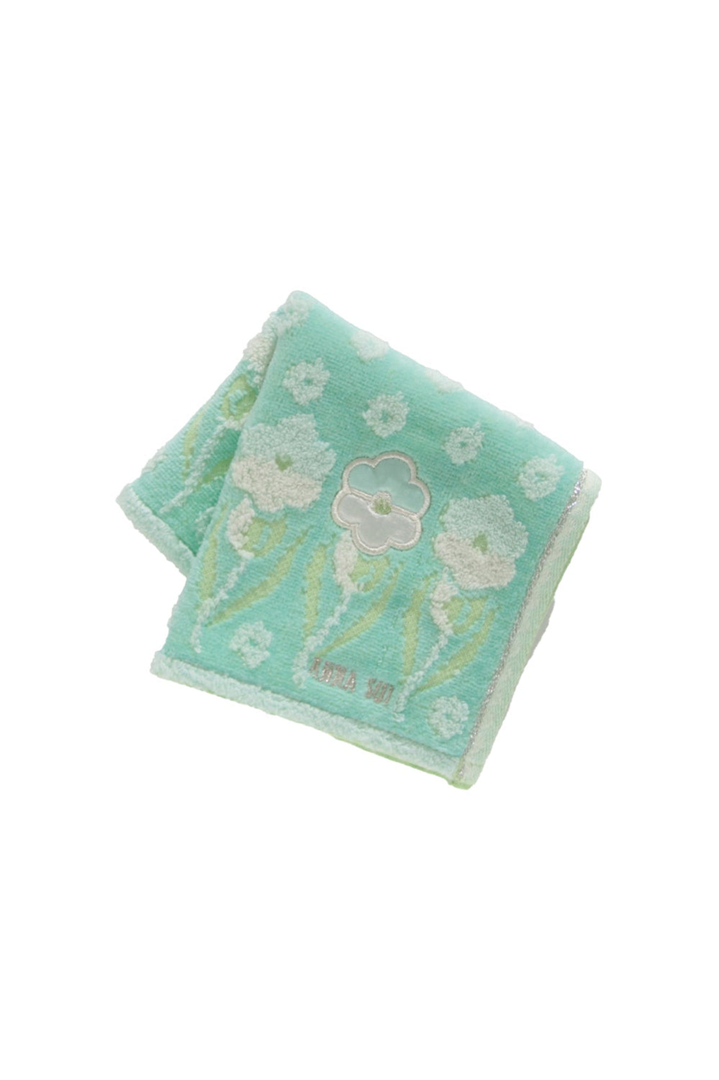 Other side of Pansy Panel Washcloth, green with lines of white Pansy, Anna Sui label at bottom 