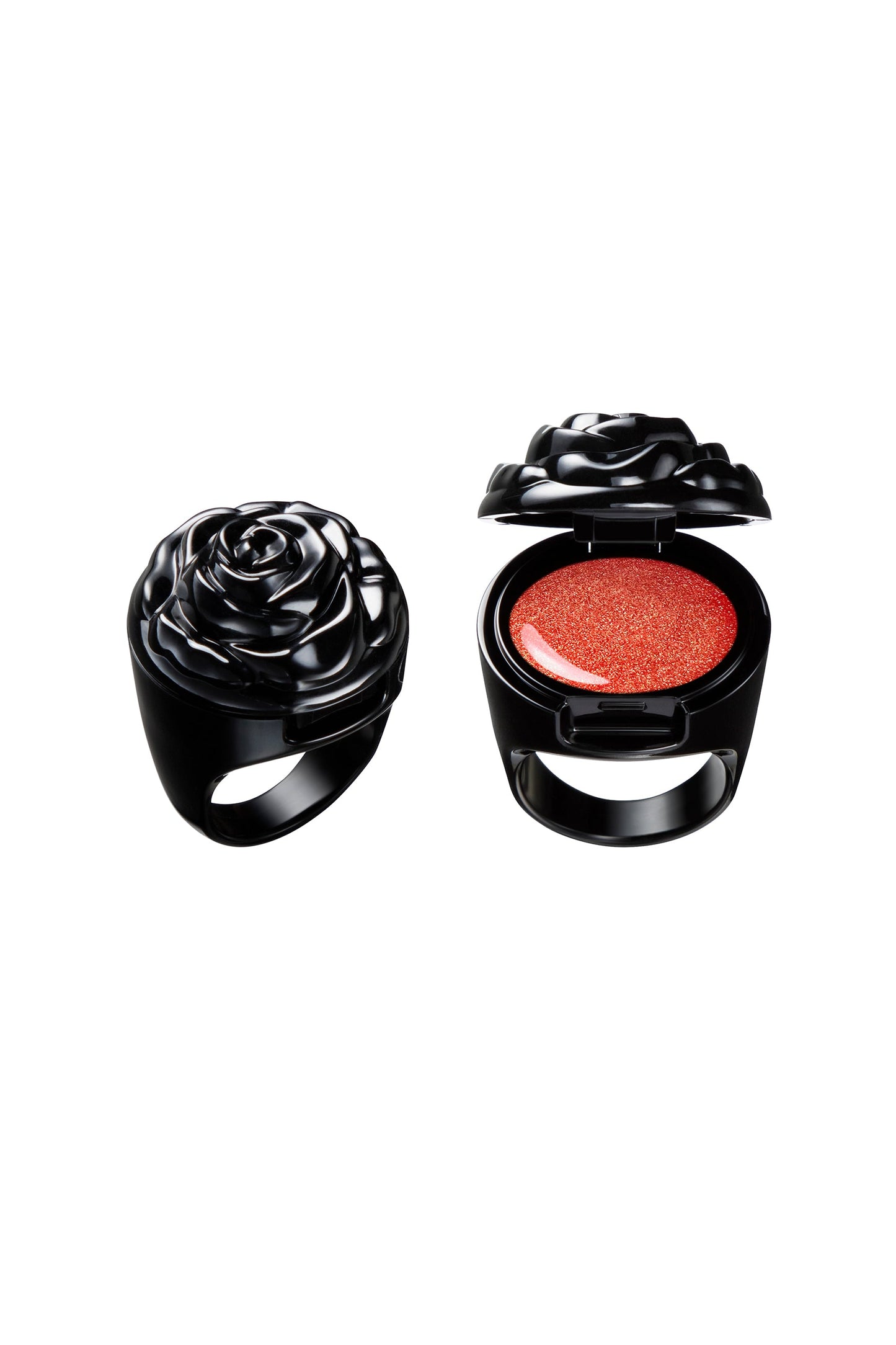 VIBRANT ORANGE in a black ring container, black rose as a cap, makeup inside