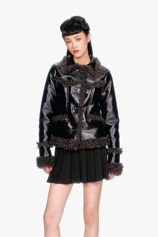 Combining edge and class, this Faux Leather W/Curly Lamb Trim Jacket features a timeless leather