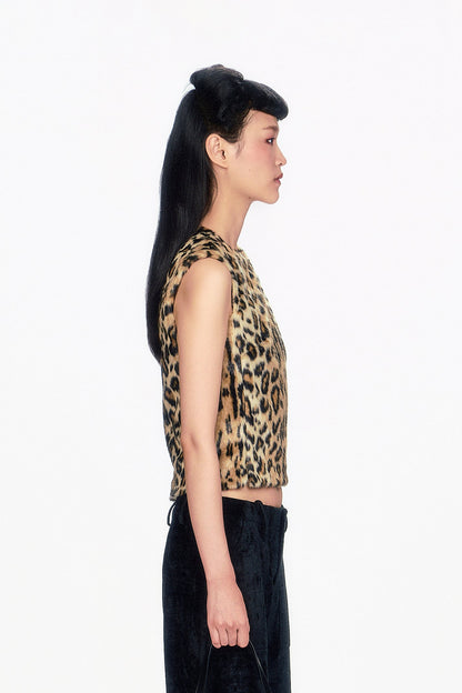 Woman wearing Faux Leopard Sleeveless Top, neckline collar and black pants.  