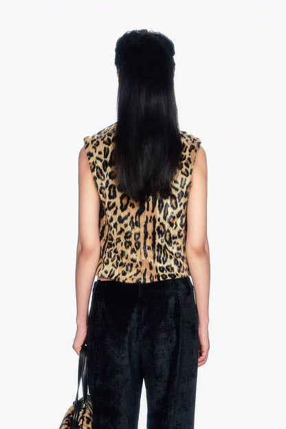 Person wearing a Faux Leopard Sleeveless Top with black pants Faux Leopard Sleeveless Top 