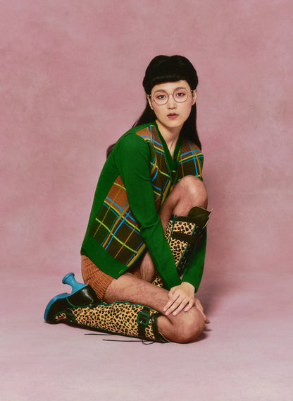 Person wearing Long Sleeves Plaid Cardigan intersecting lines in green, brown, and blue open on front