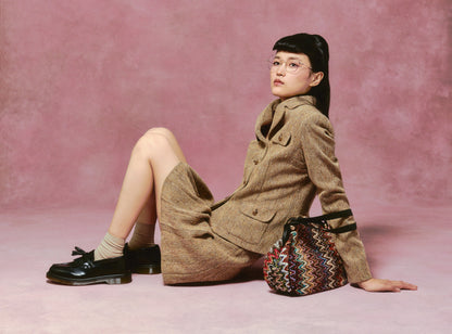 Woman with a Bargello Memento Bag, it’s roomy, durable, and perfect for everyday use.