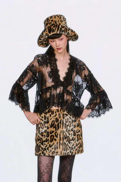 The Victorian Lace V-Neck Top in black features delicate lace accents and a flowy silhouette. 