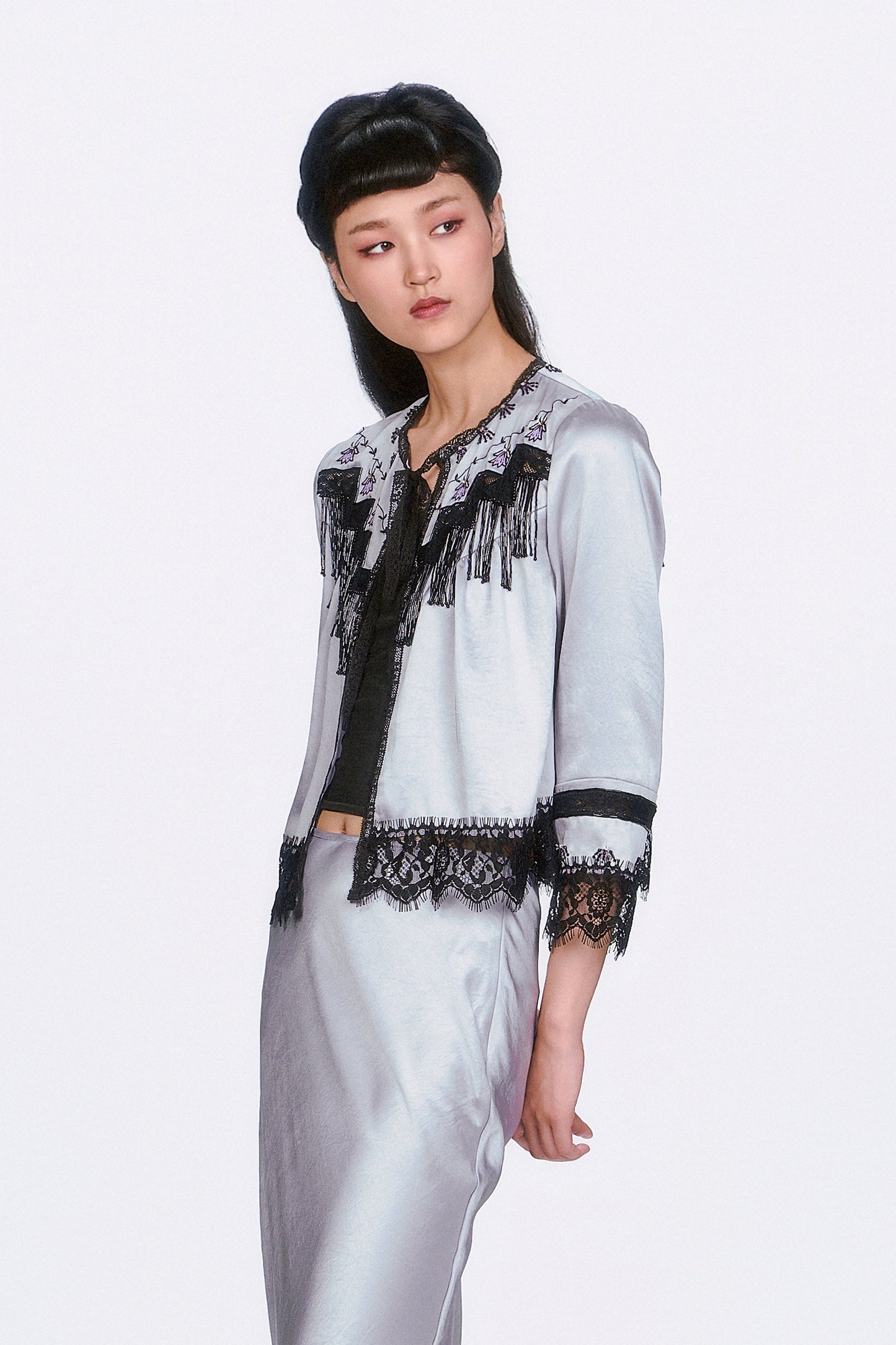 Boudoir Satin Beaded Fringe Bed Silver Jacket, black lace at bottom hems and sleeves, ribbon at collar.