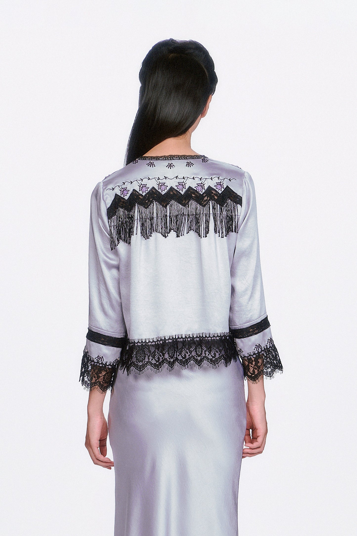 Boudoir Satin Beaded Fringe Bed Silver Jacket, black zigzag pattern & fringe at shoulders, hems with lace.