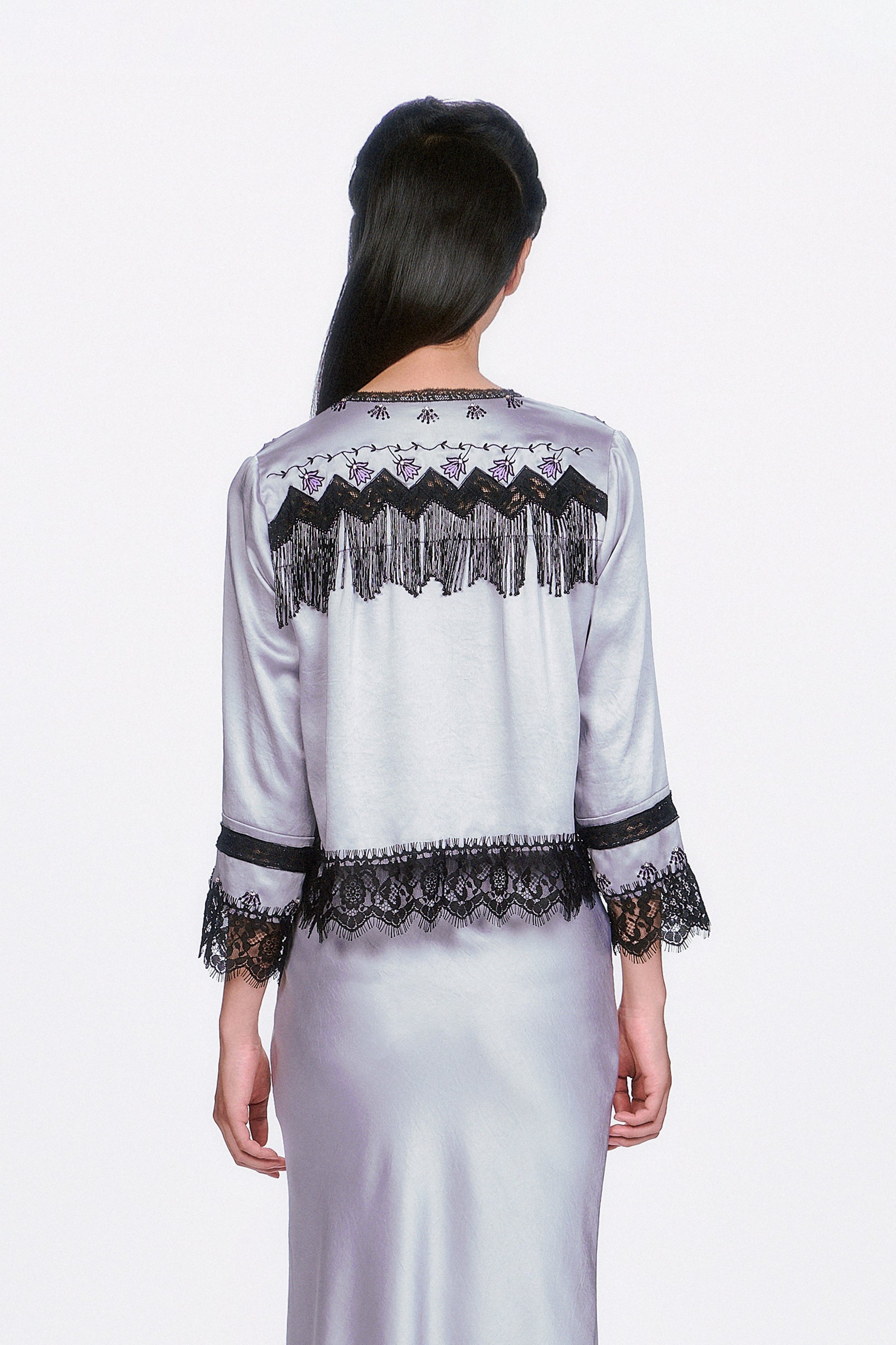 Boudoir Satin Beaded Fringe Bed Silver Jacket, black zigzag pattern & fringe at shoulders, hems with lace.