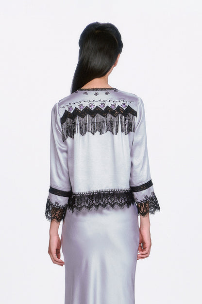 Boudoir Satin Beaded Fringe Bed Silver Jacket, black zigzag pattern & fringe at shoulders, hems with lace.