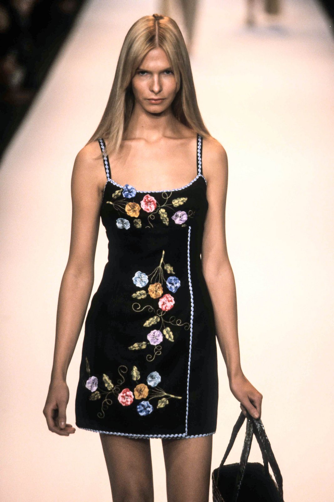 Under runway lights, 3-D Pansy Embroidered on Linen Dress, baby blue hem, bouquets design on front