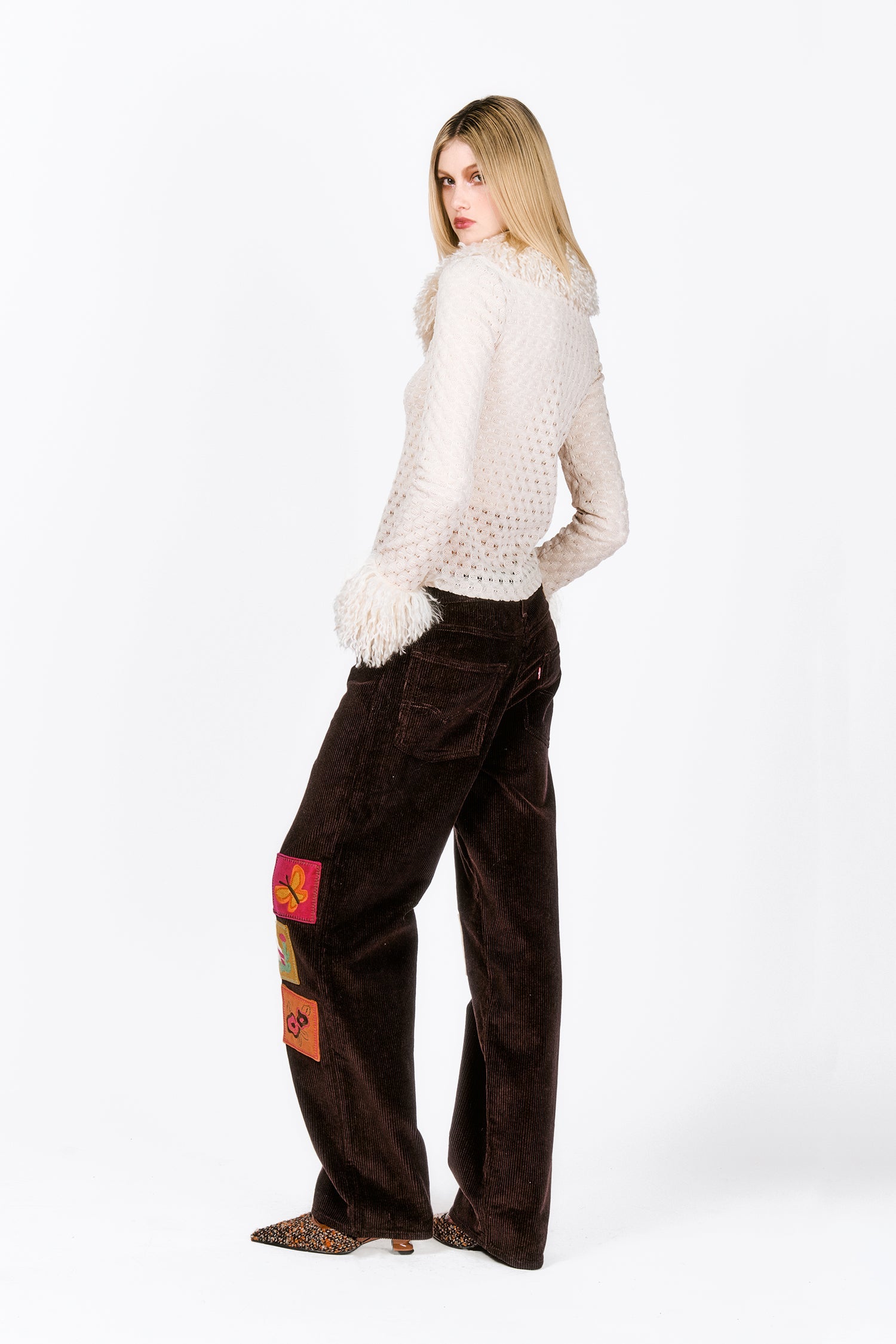 Embroidered Velveteen, brown pans, large stiches on the side of legs, back pocket