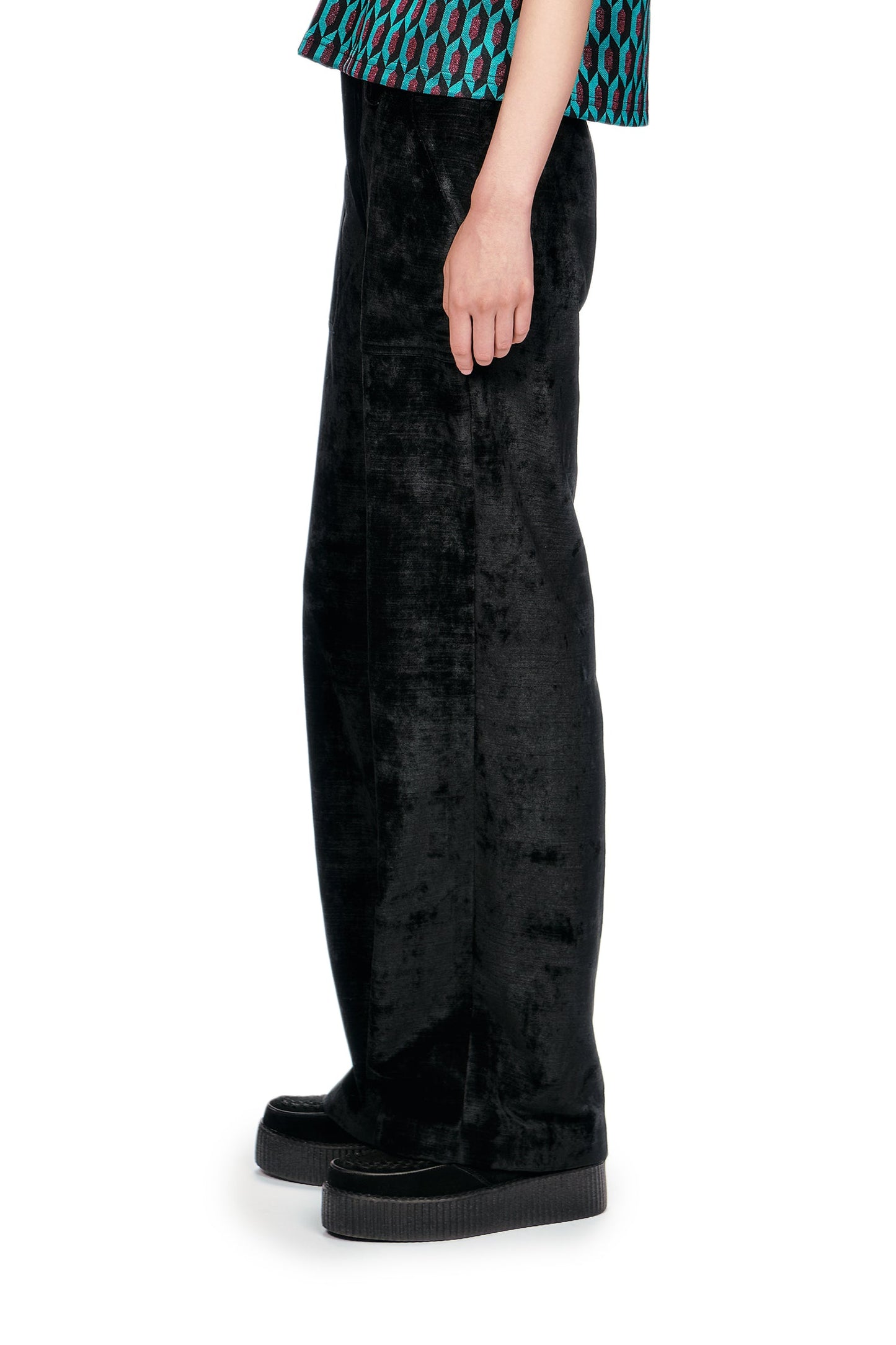 Person wearing Black Velour pants with a relaxed fit, practical side pockets, perfect for everyday