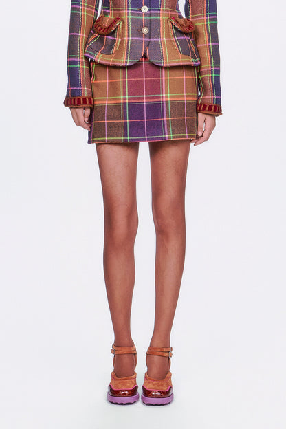 Bold meets classic in this mini skirt featuring a caramel base with vibrant magenta plaid. 