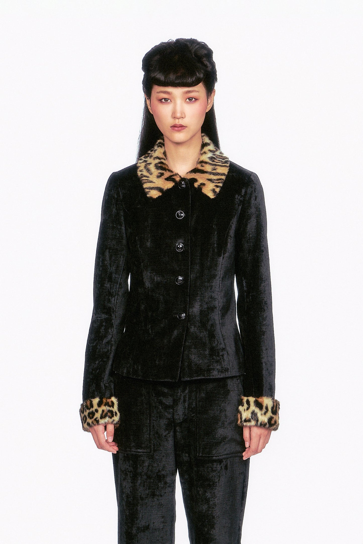 FALL-2025-20 Velour Jacket
The Velour Jacket black, 5-buttons, featuring faux fur leopard accents on the collar and cuffs.
