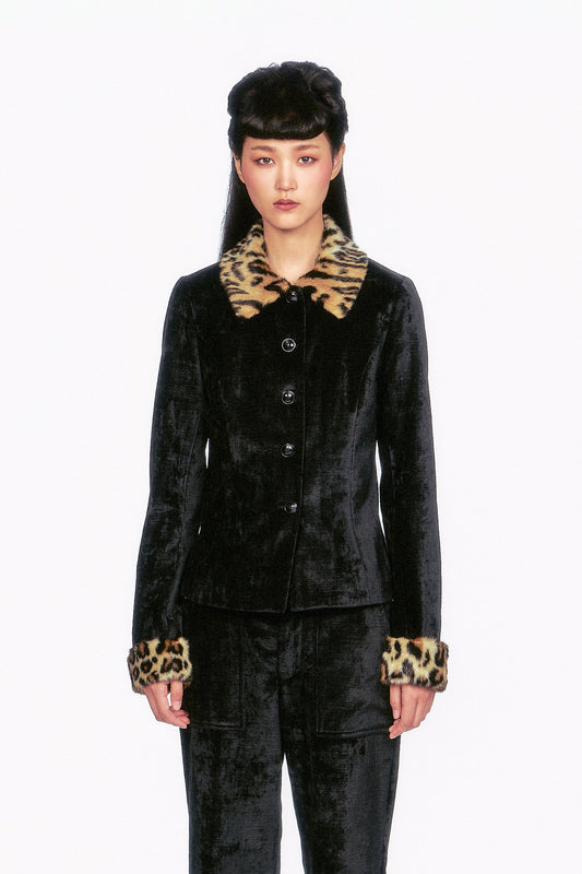 FALL-2025-20 Velour Jacket
The Velour Jacket black, 5-buttons, featuring faux fur leopard accents on the collar and cuffs.
