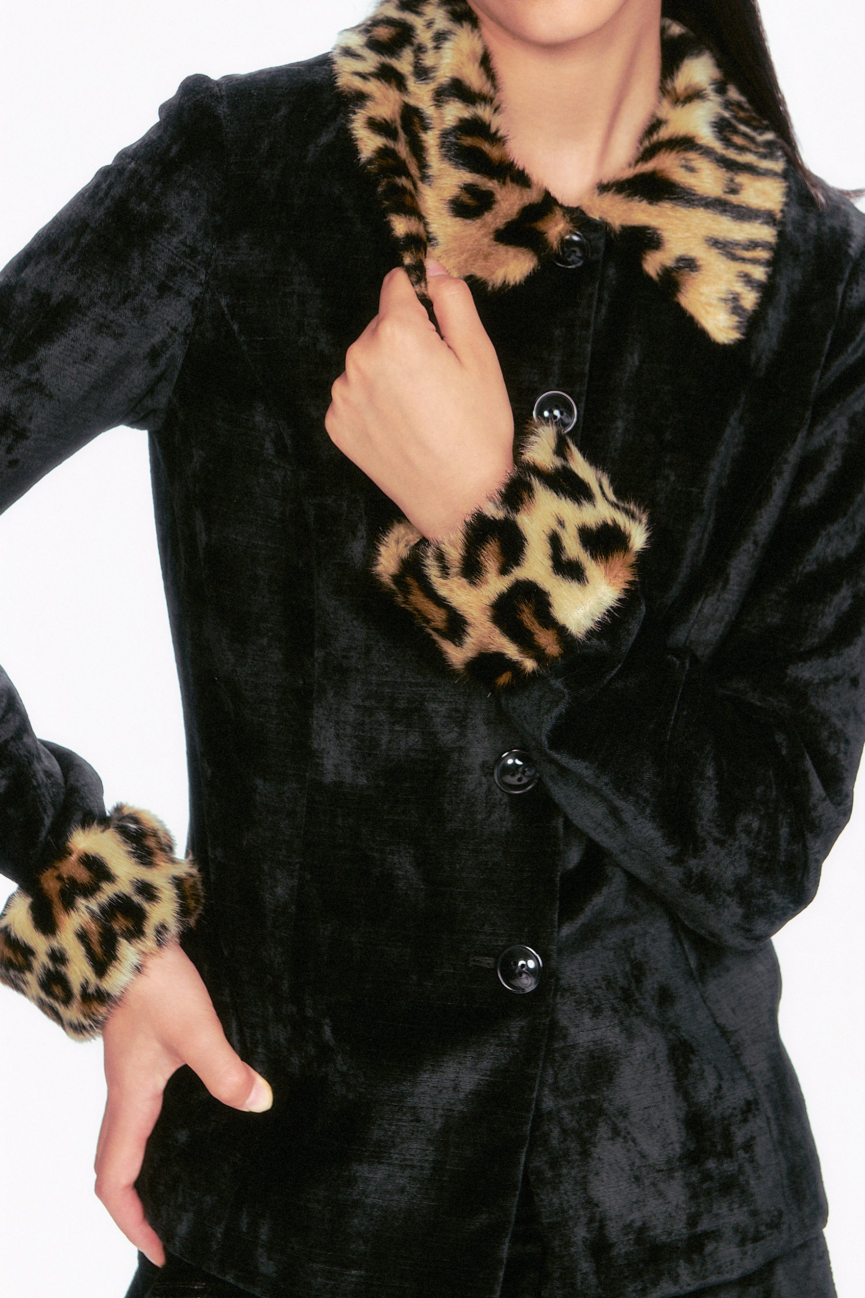 The Velour Jacket black, 5-buttons, featuring faux fur leopard accents on the collar and cuffs.