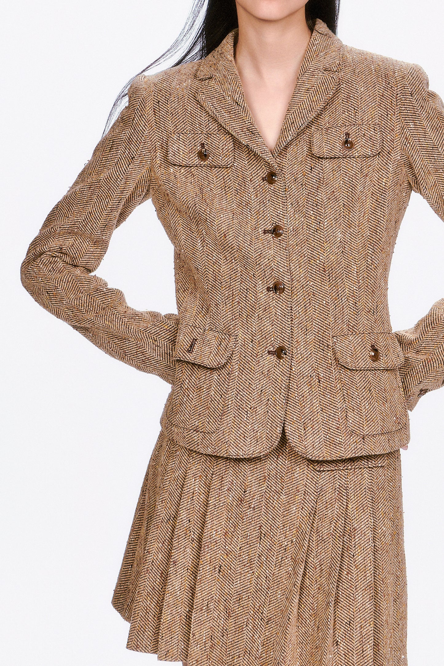 Herringbone Jacket a wardrobe essential that effortlessly elevates both professional and casual looks.