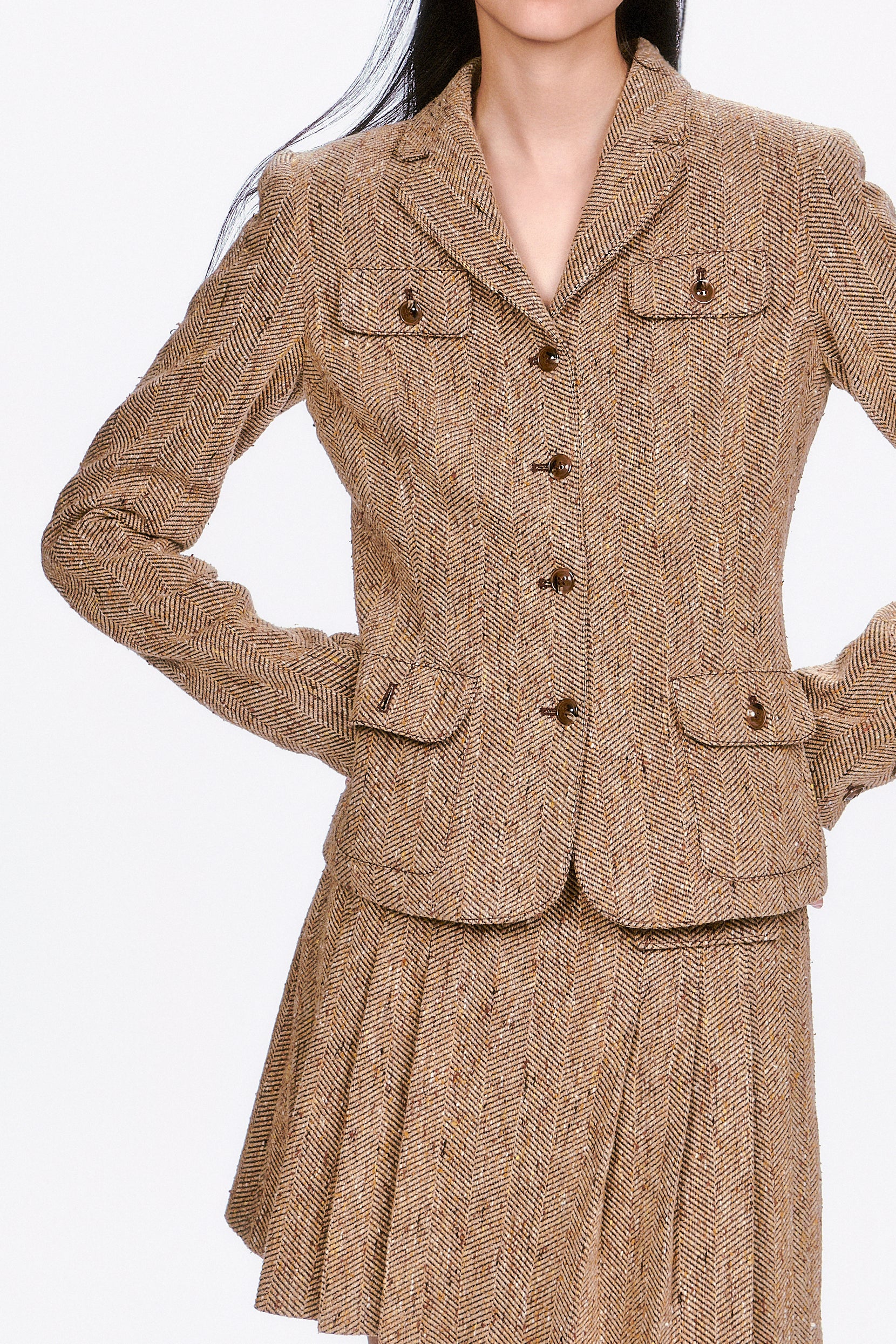 Herringbone Jacket a wardrobe essential that effortlessly elevates both professional and casual looks.