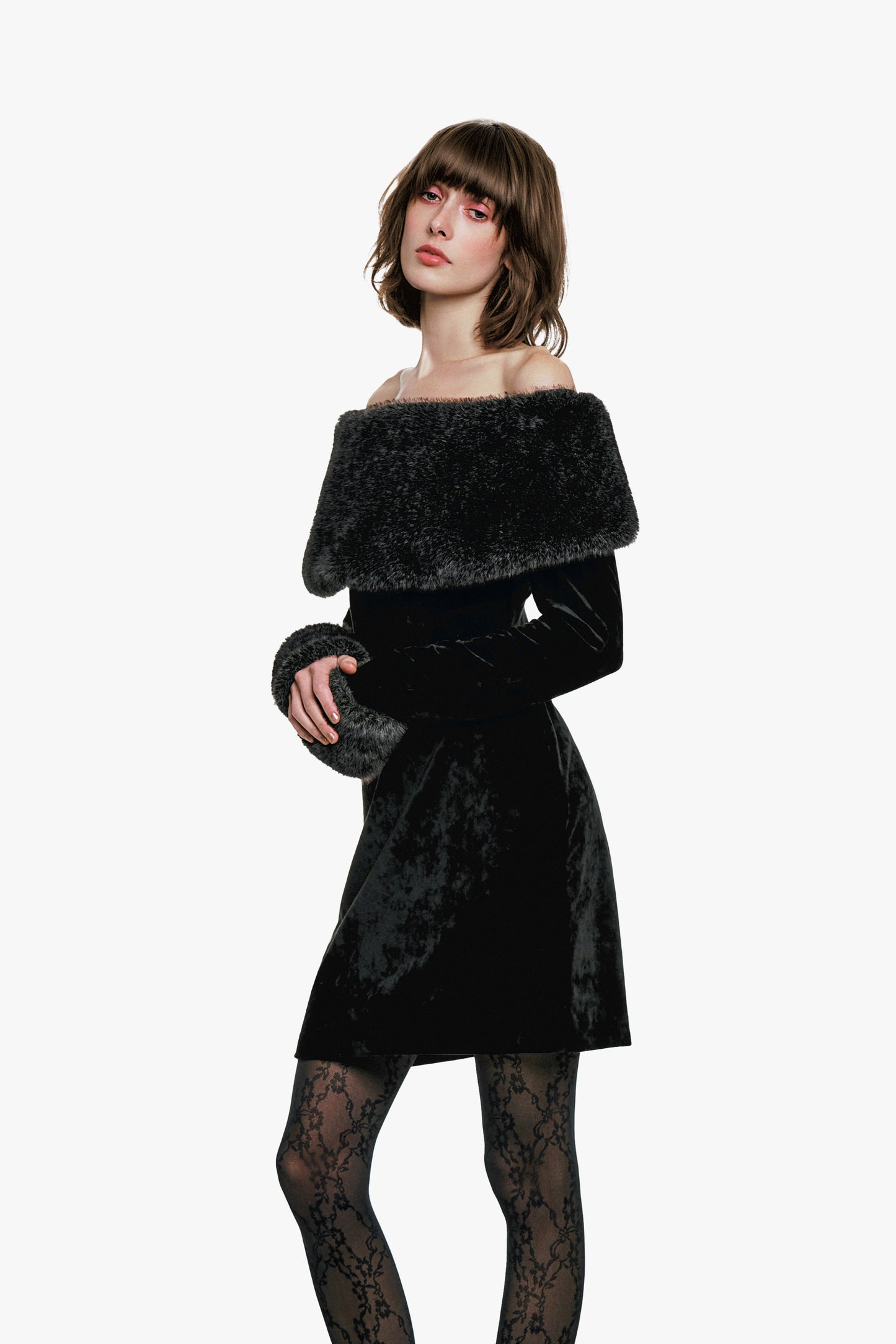 The silhouette gently wraps the body for a flattering fit—perfect for special occasion or evening event