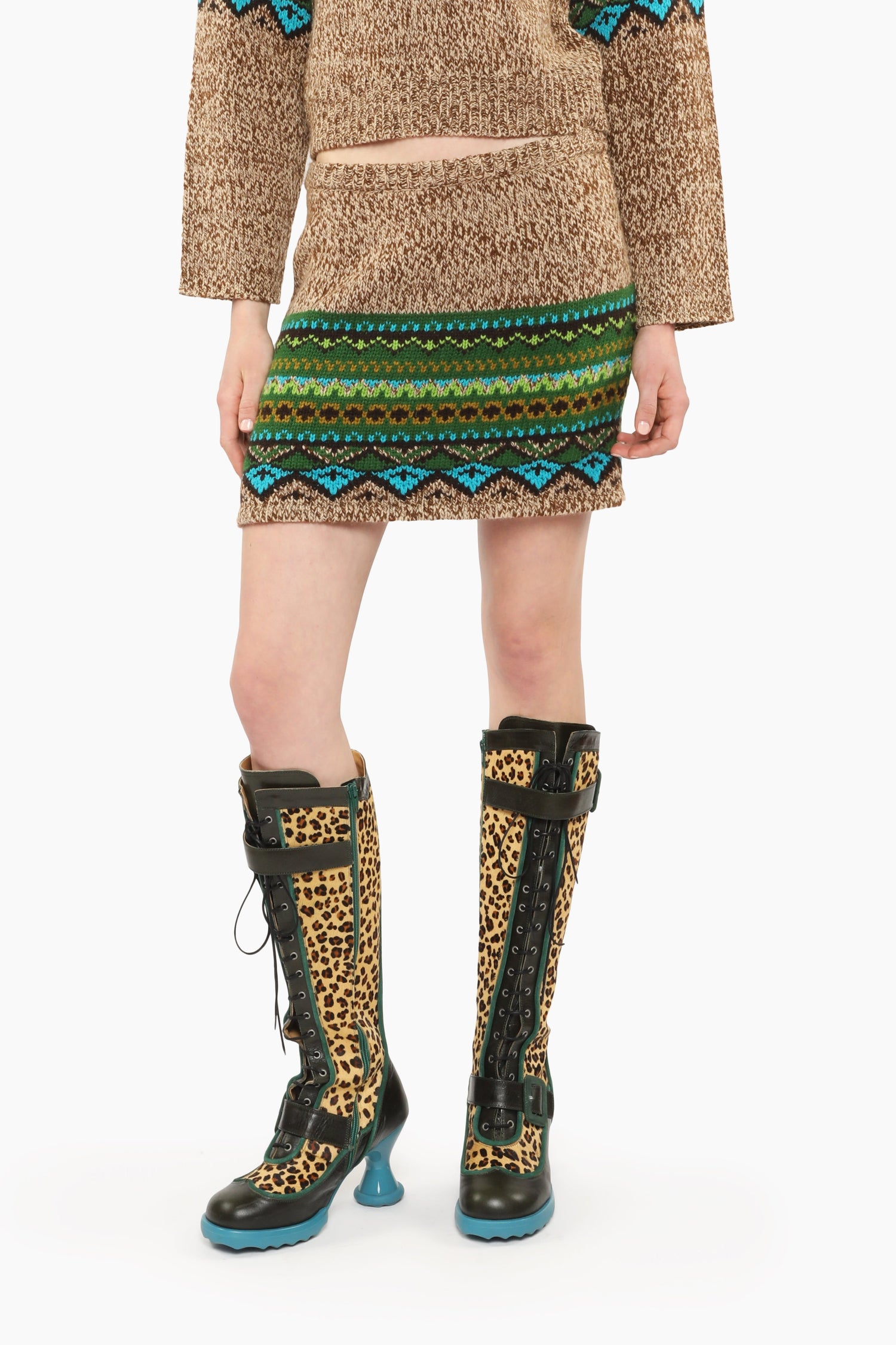 Fair Isle Mini Skirt – Teal with pattern hue of green and blue triangles mini skirt with knee-high boots