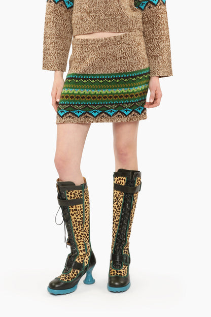 Fair Isle Mini Skirt – Teal with pattern hue of green and blue triangles mini skirt with knee-high boots