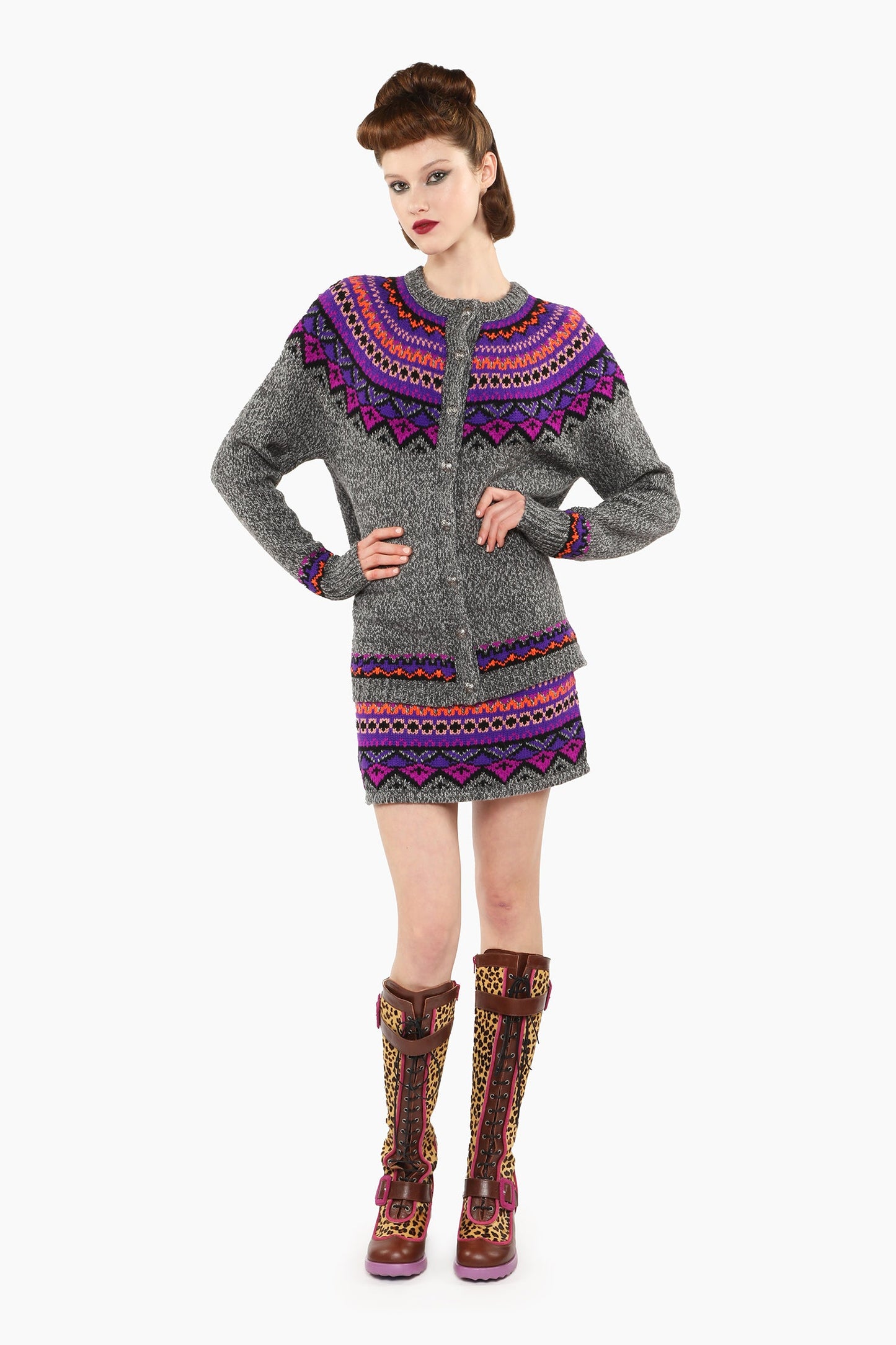 Fair Isle Cardigan, long sleeves, shoulders and top arms pattern hue of magenta and blue triangles.