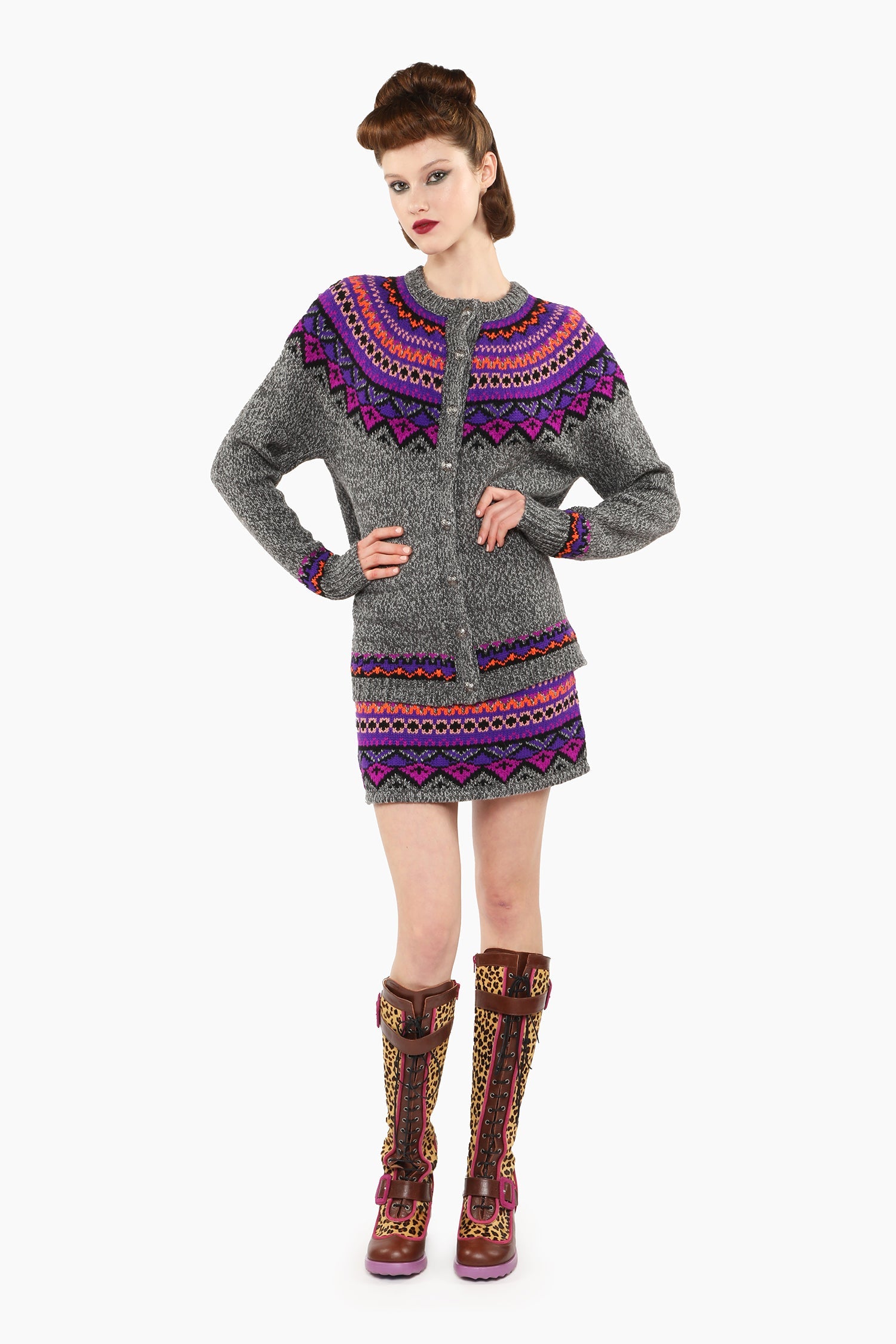 Fair Isle Cardigan, long sleeves, shoulders and top arms pattern hue of magenta and blue triangles.