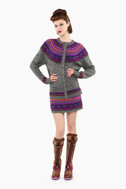 Fair Isle Cardigan, long sleeves, shoulders and top arms pattern hue of magenta and blue triangles.