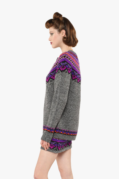 Fair Isle Cardigan, magenta wears with same pattern hue of green and blue triangles mini skirt.