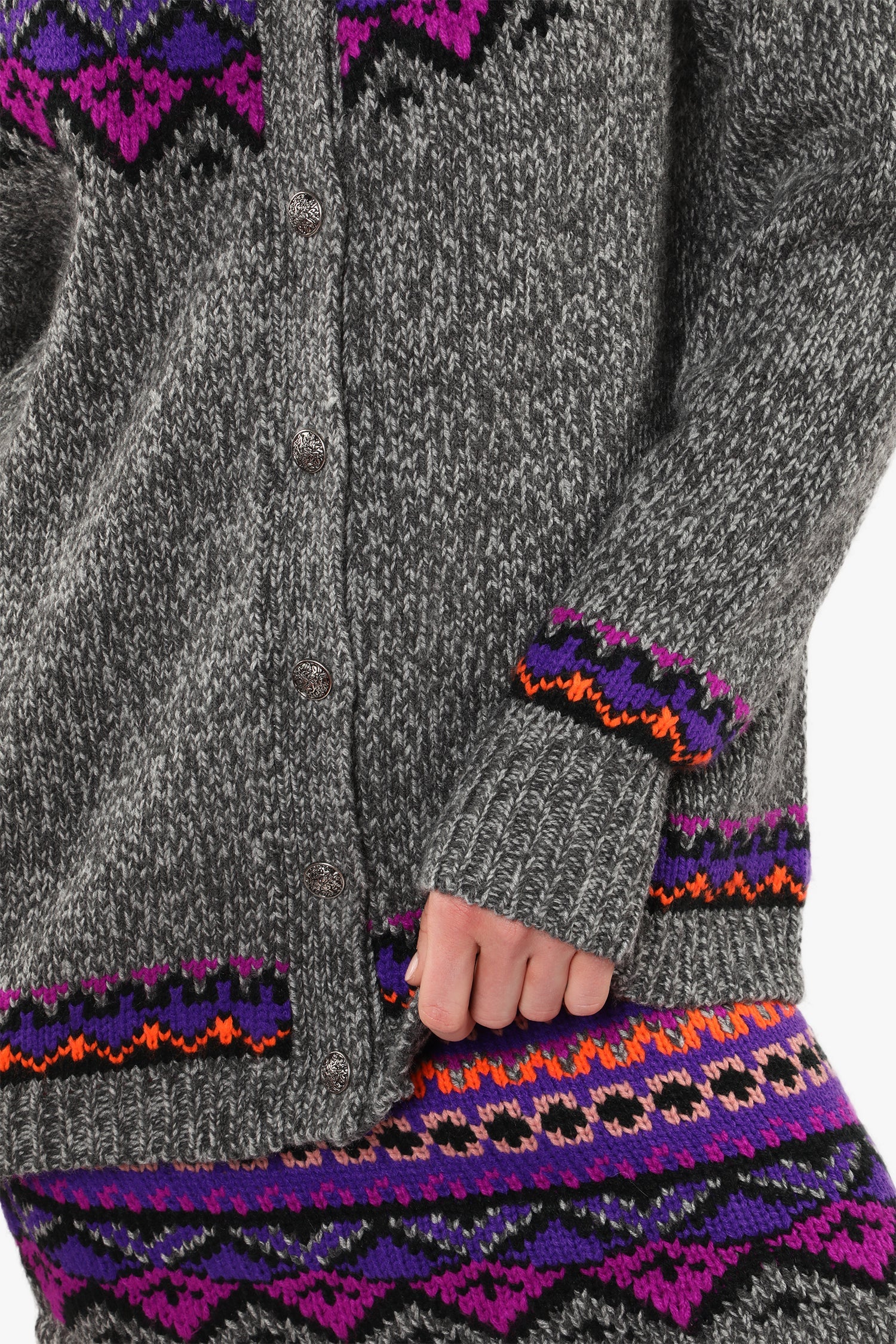 Pattern hue of magenta, black and gray lines and blue triangles with black border at bottom.