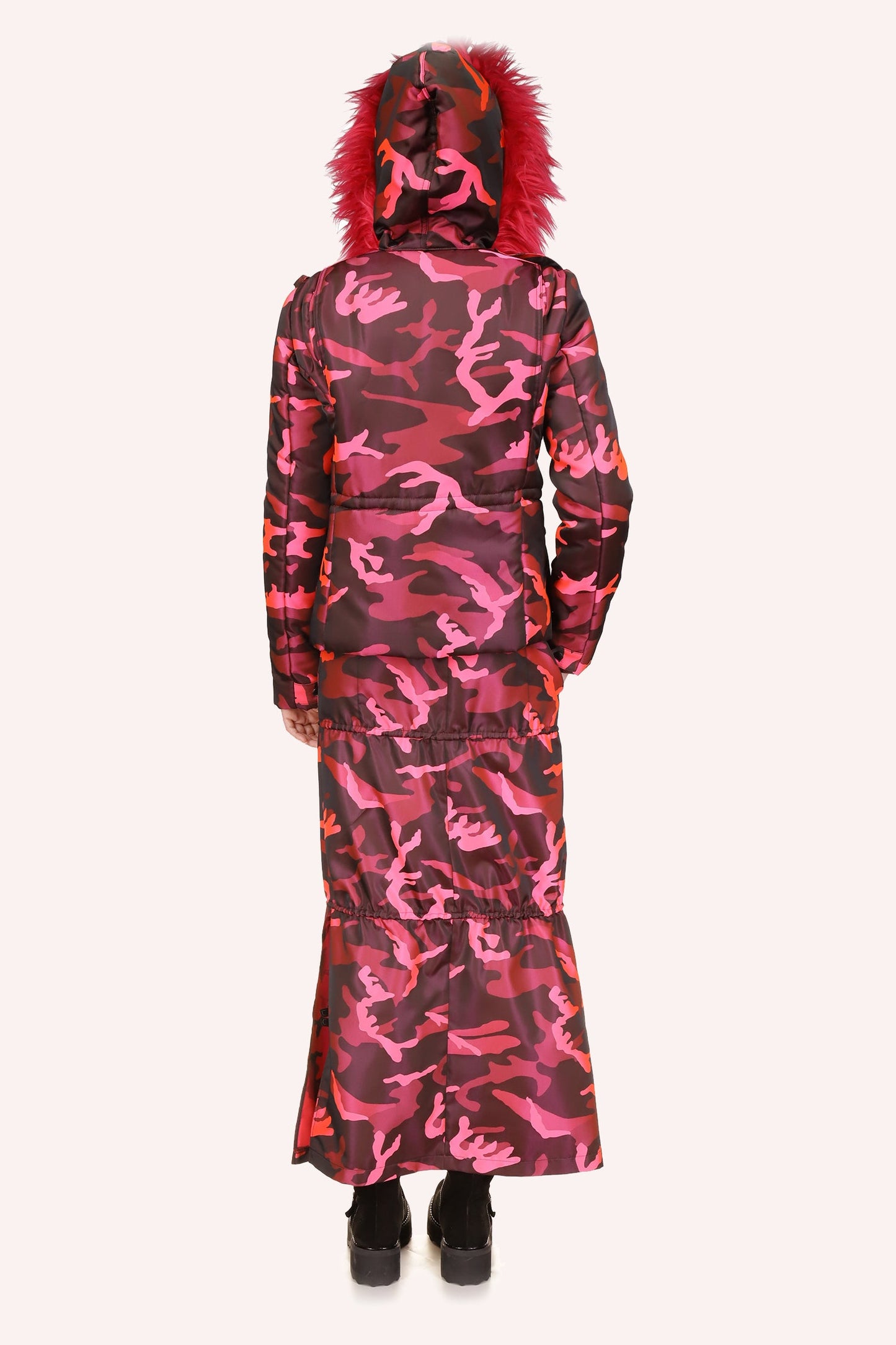 The Neon Camouflage jacket Hot Pink has a long hip-length with fluffy fur hood, and a waist belt