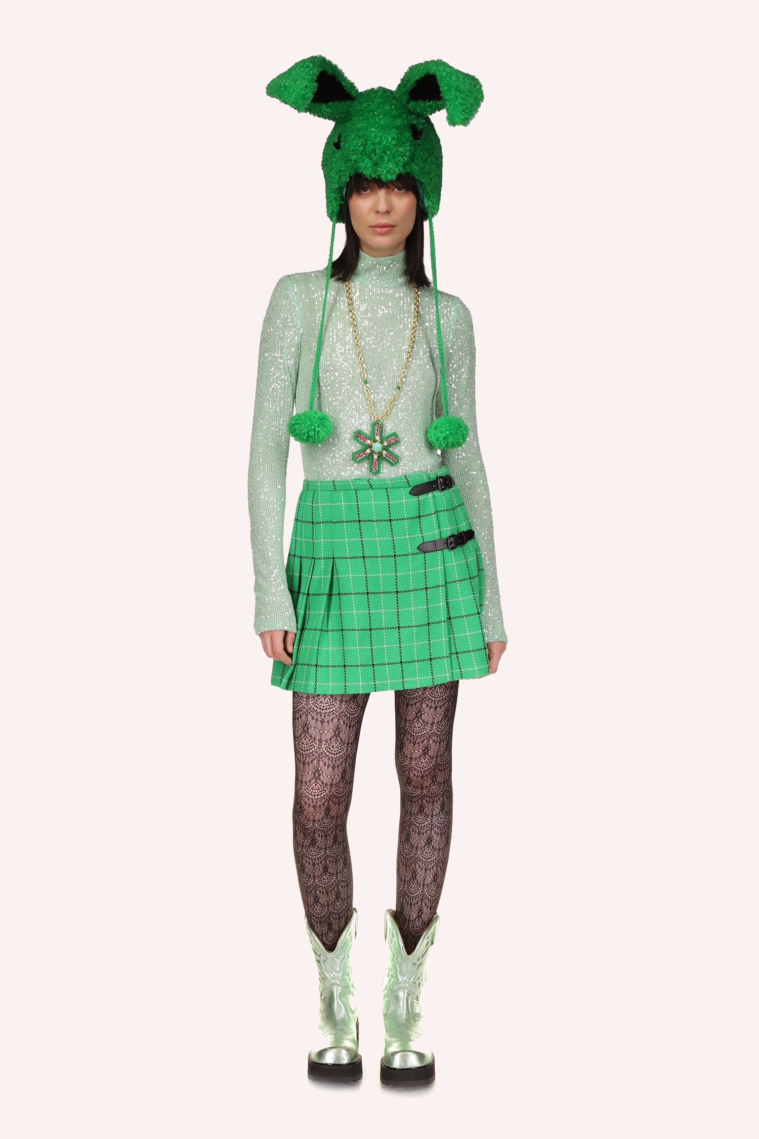 Mini skirt, Irish green, pattern of dark green and white squares, left side of the skirt 2 black buckles pleated under 