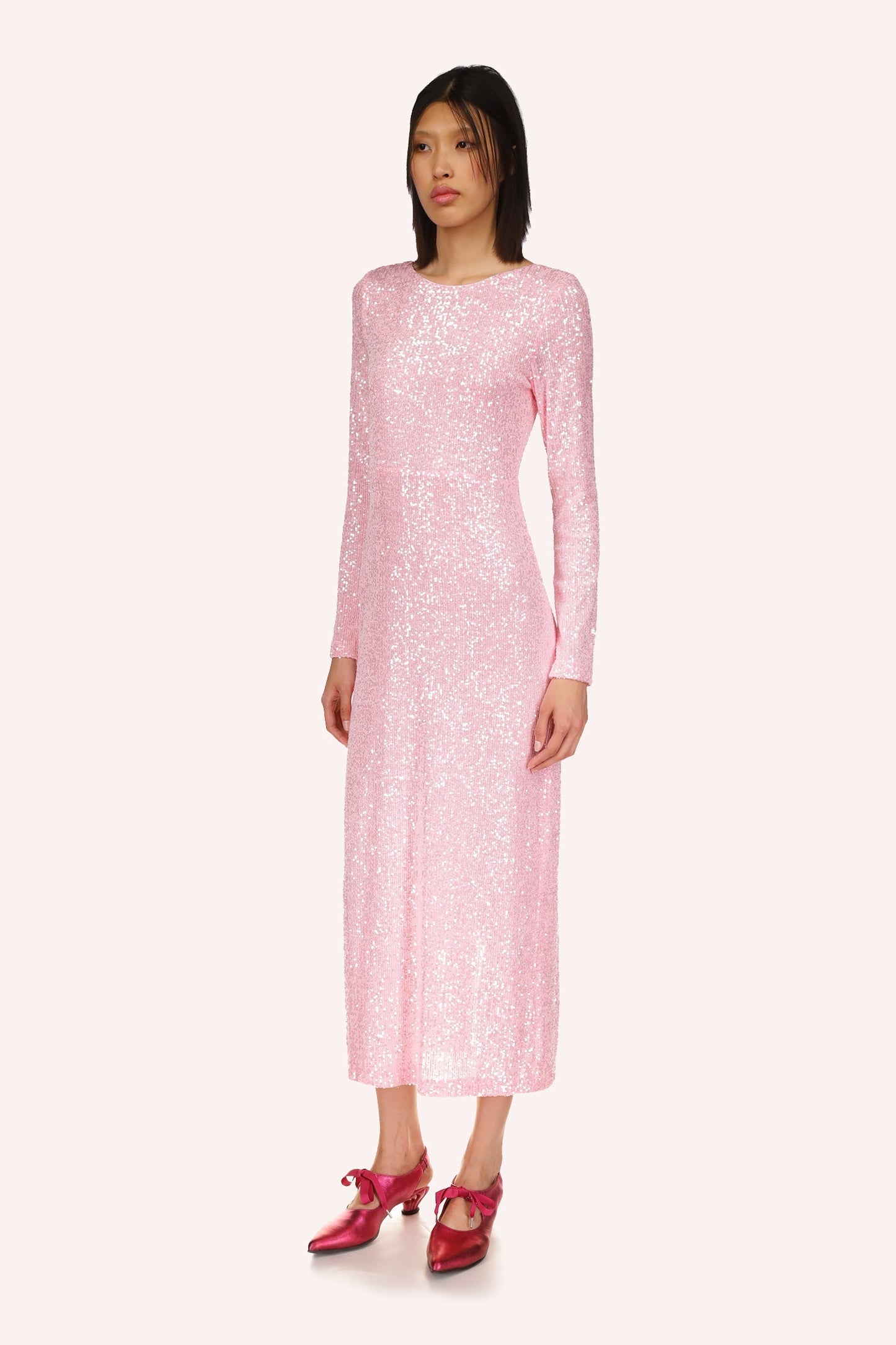 Sequin Mesh mid-calf long designed by Anna Sui, is a sophisticated gown in a soft baby pink color