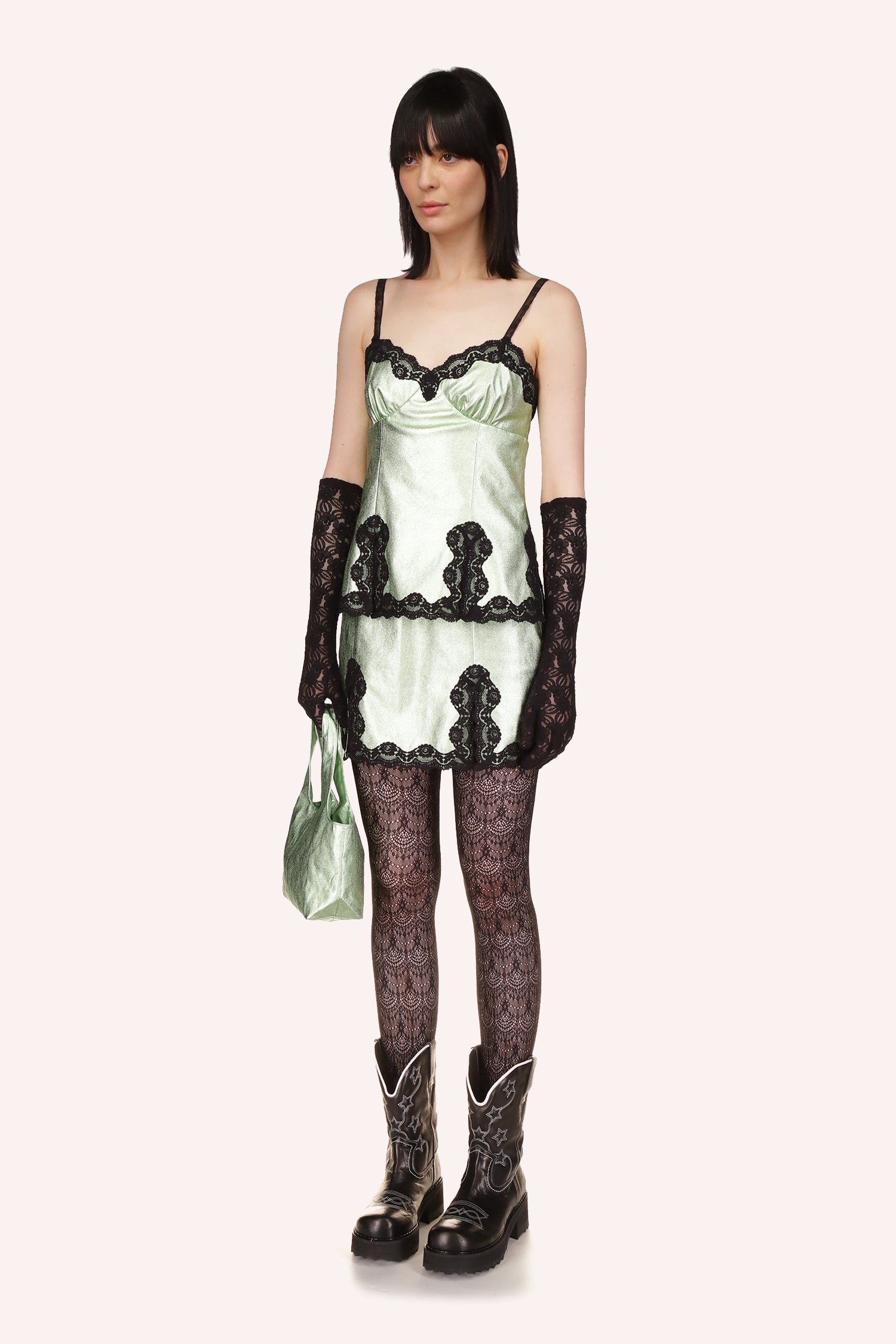 Anna Sui's Camisole Top Peppermint, sleeveless, with black straps over the shoulders, black lace around the top and bottom