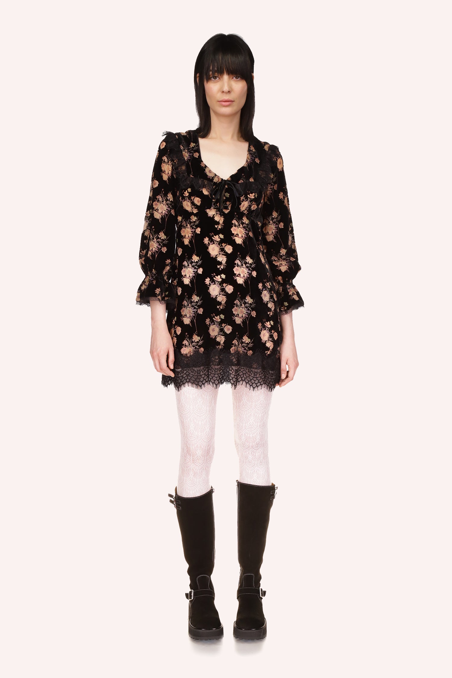 Black dress with beige floral pattern, V-shaped collar, long sleeves, black lace at collar and hem