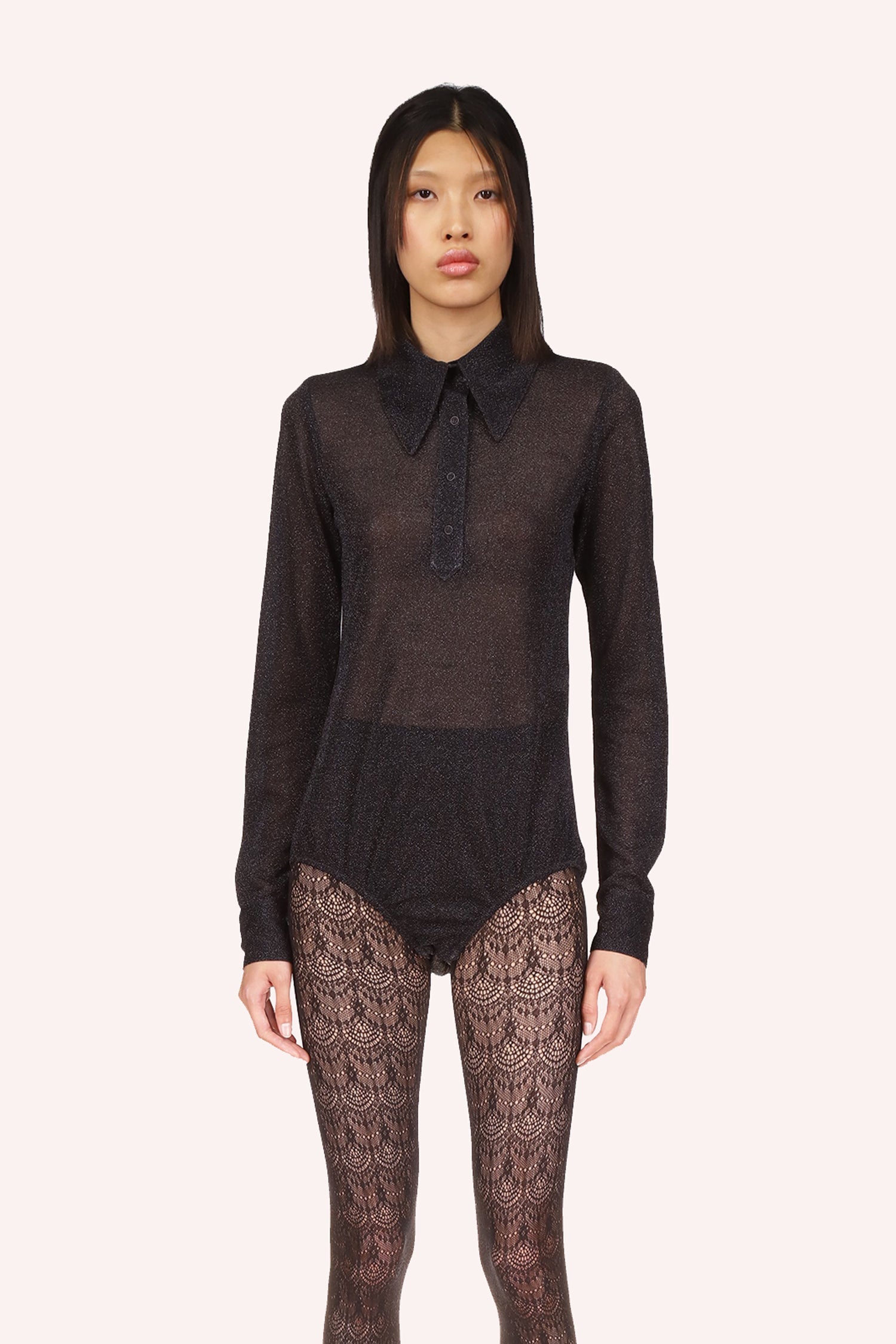 Black see-through material shoulders to hips, long sleeves, black zipper on the back