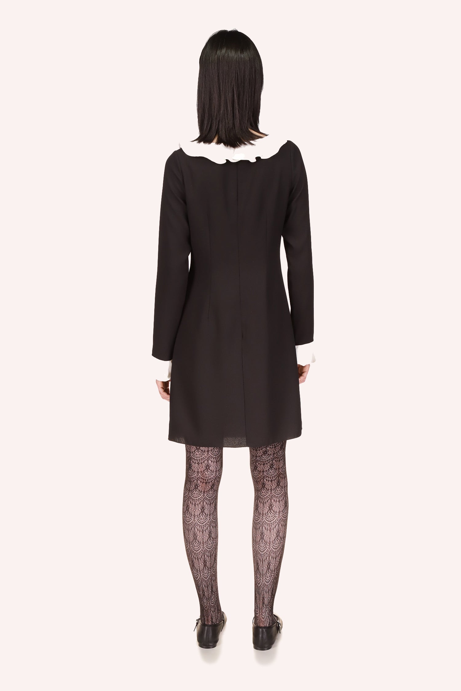 Back of a Black Dress, above-the-knee, vanilla crepe on the long sleeves and collar borders